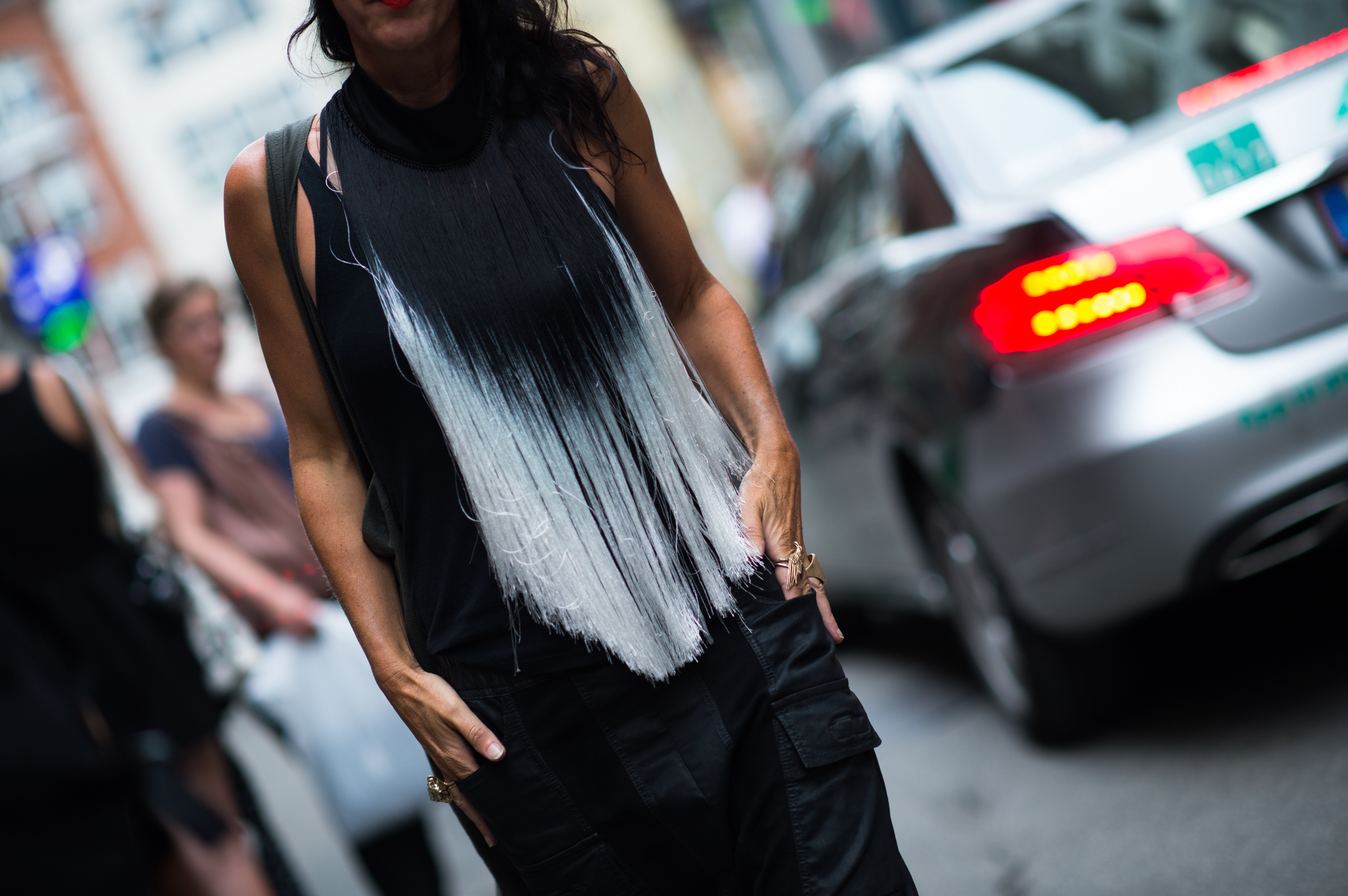 Woman wearing fringe neck piece