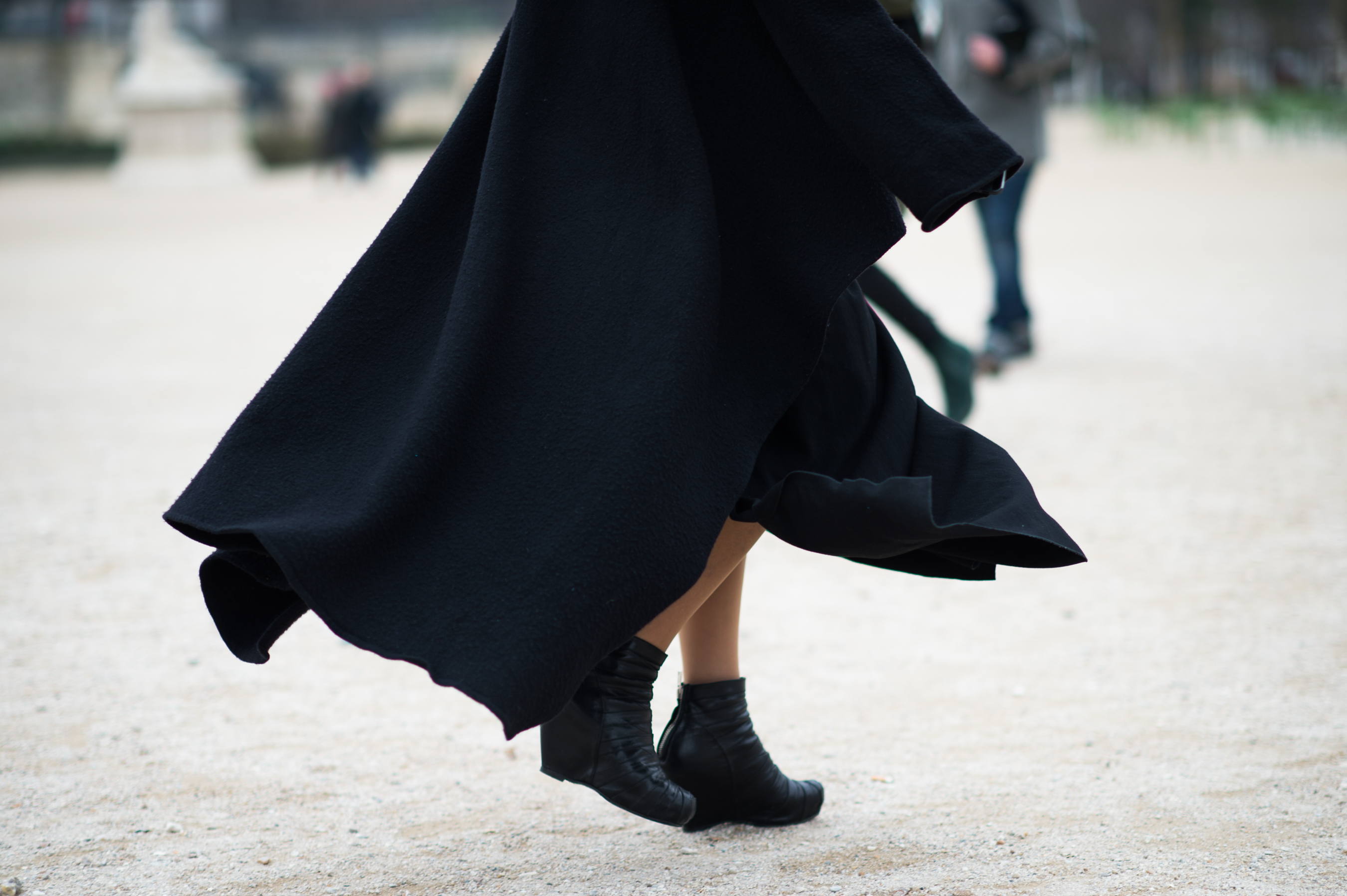 Woman wearing black boiled wool coat