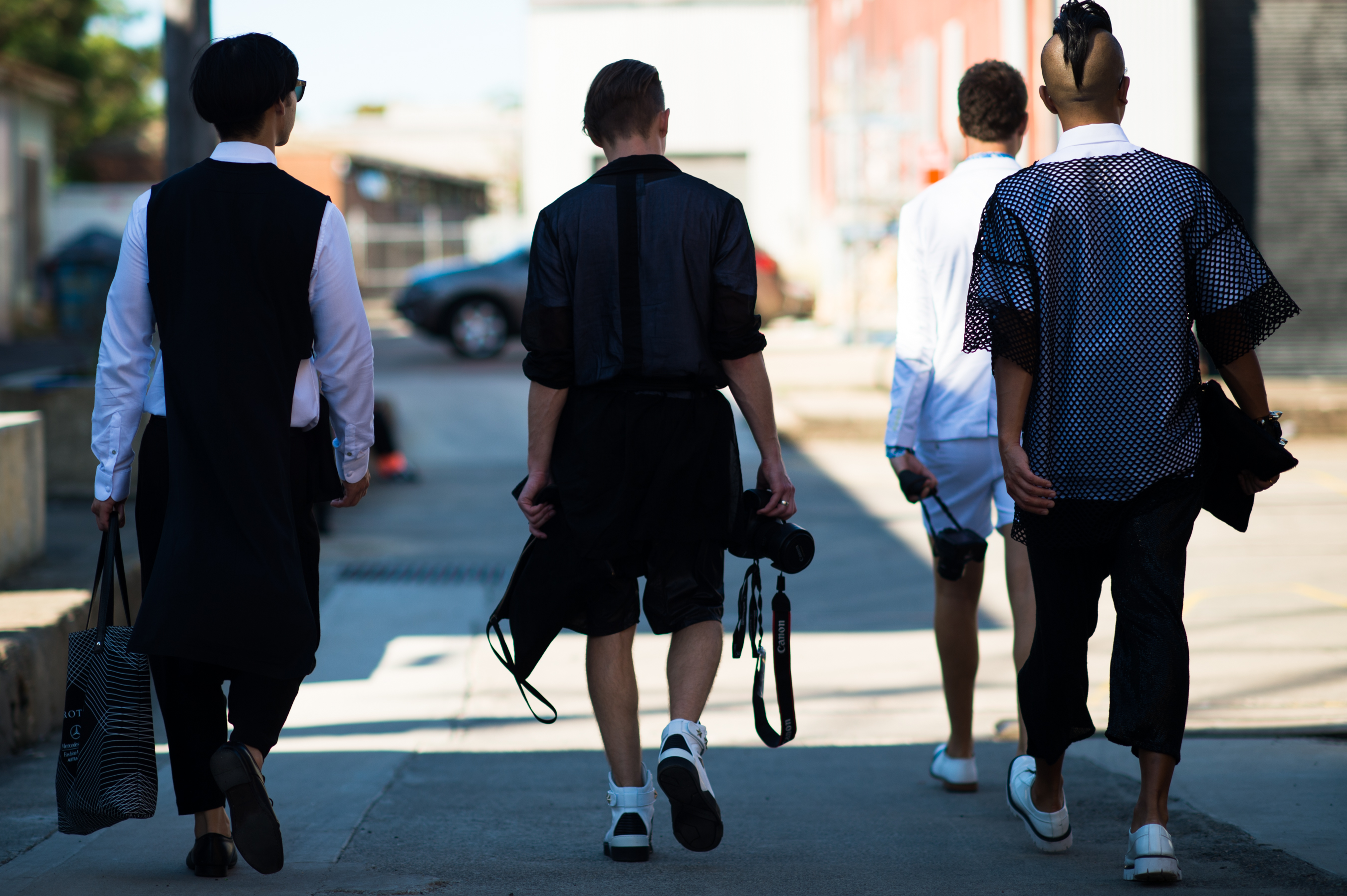 New Zealand men walking wearing black
