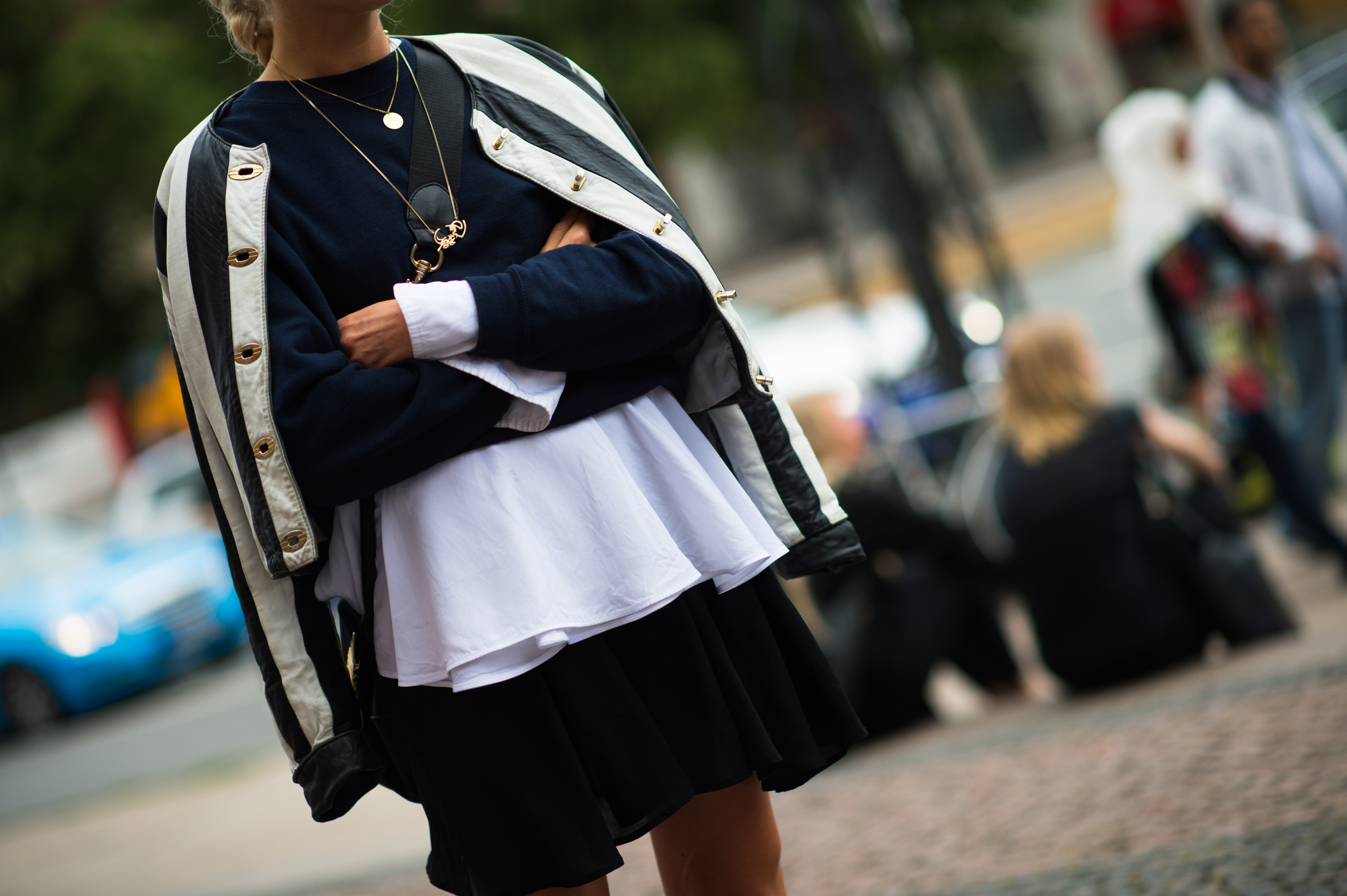 Woman wearing striped leather jacket