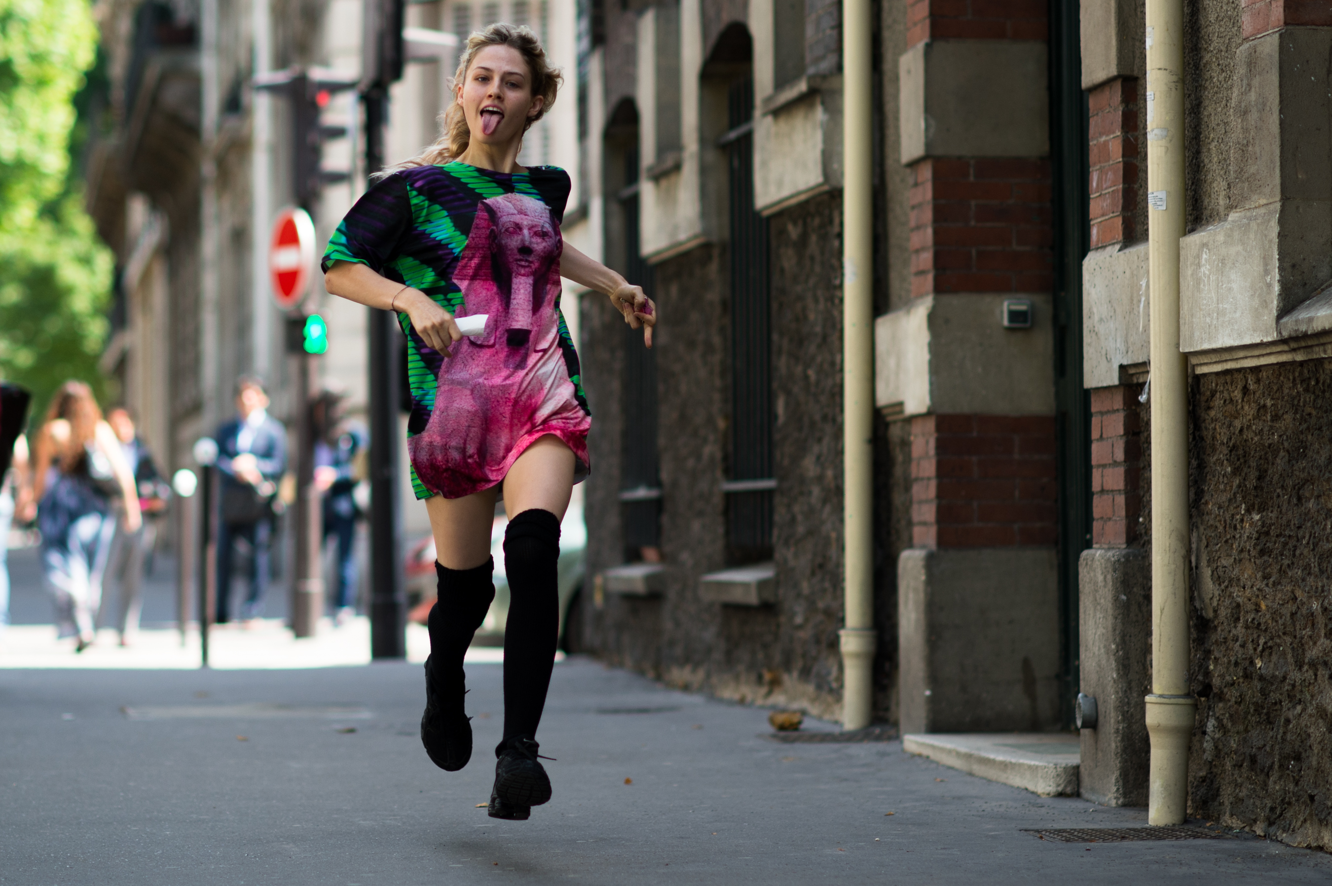 Model running sticking tongue out