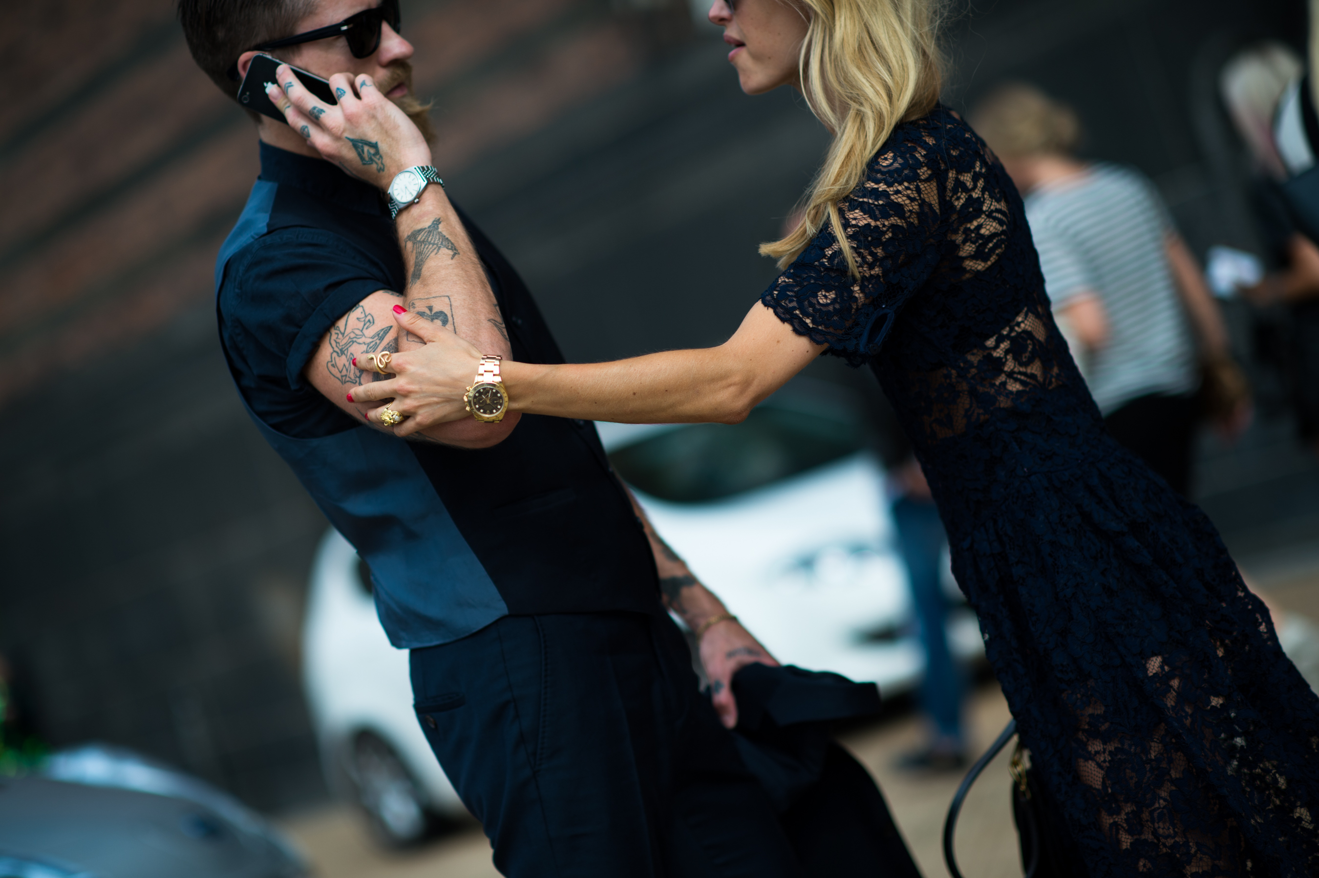 Man with tattoos girl in lace dress