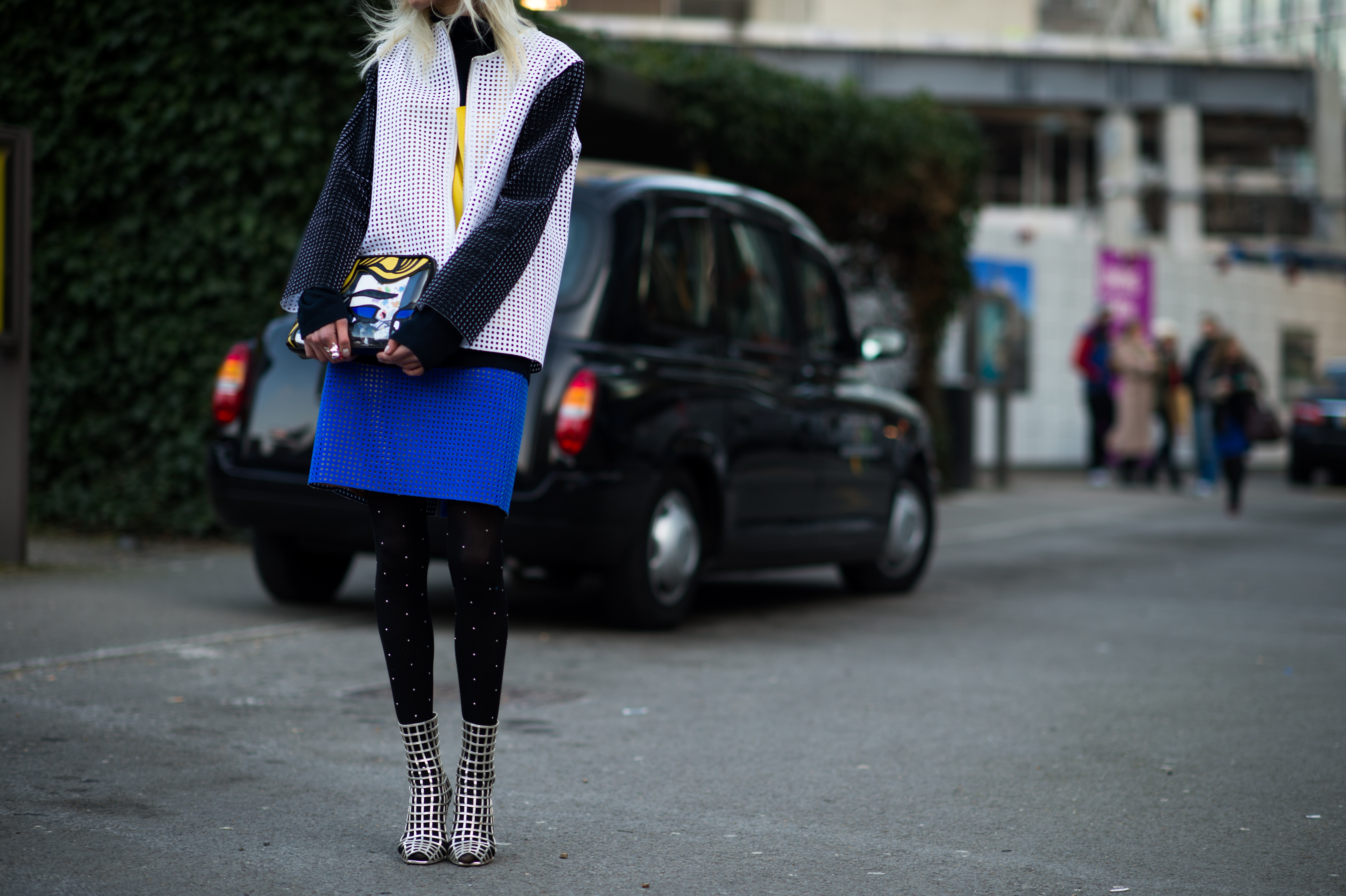 Girl wearing laser cut top and skit