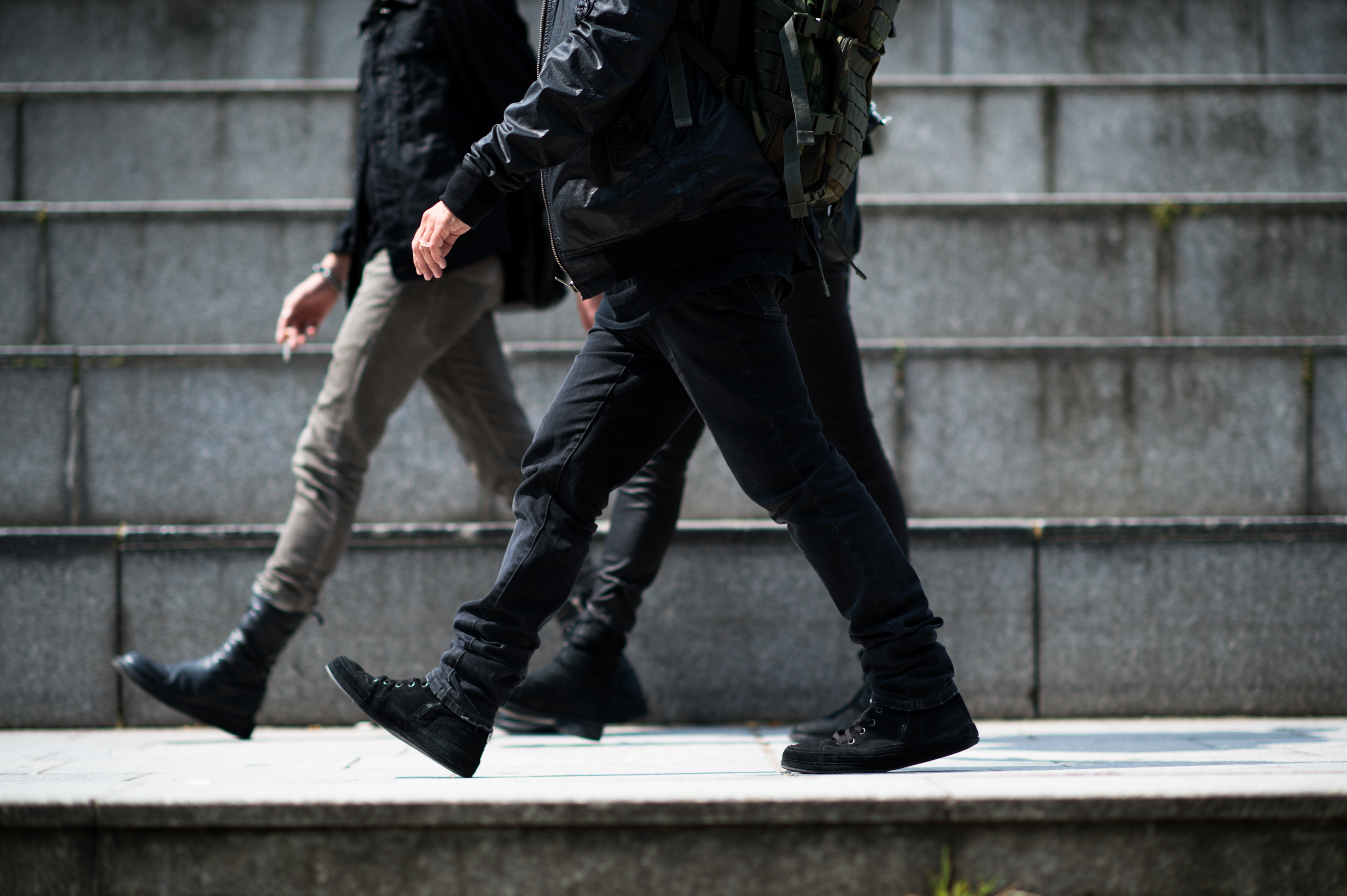 Three people wearing all black
