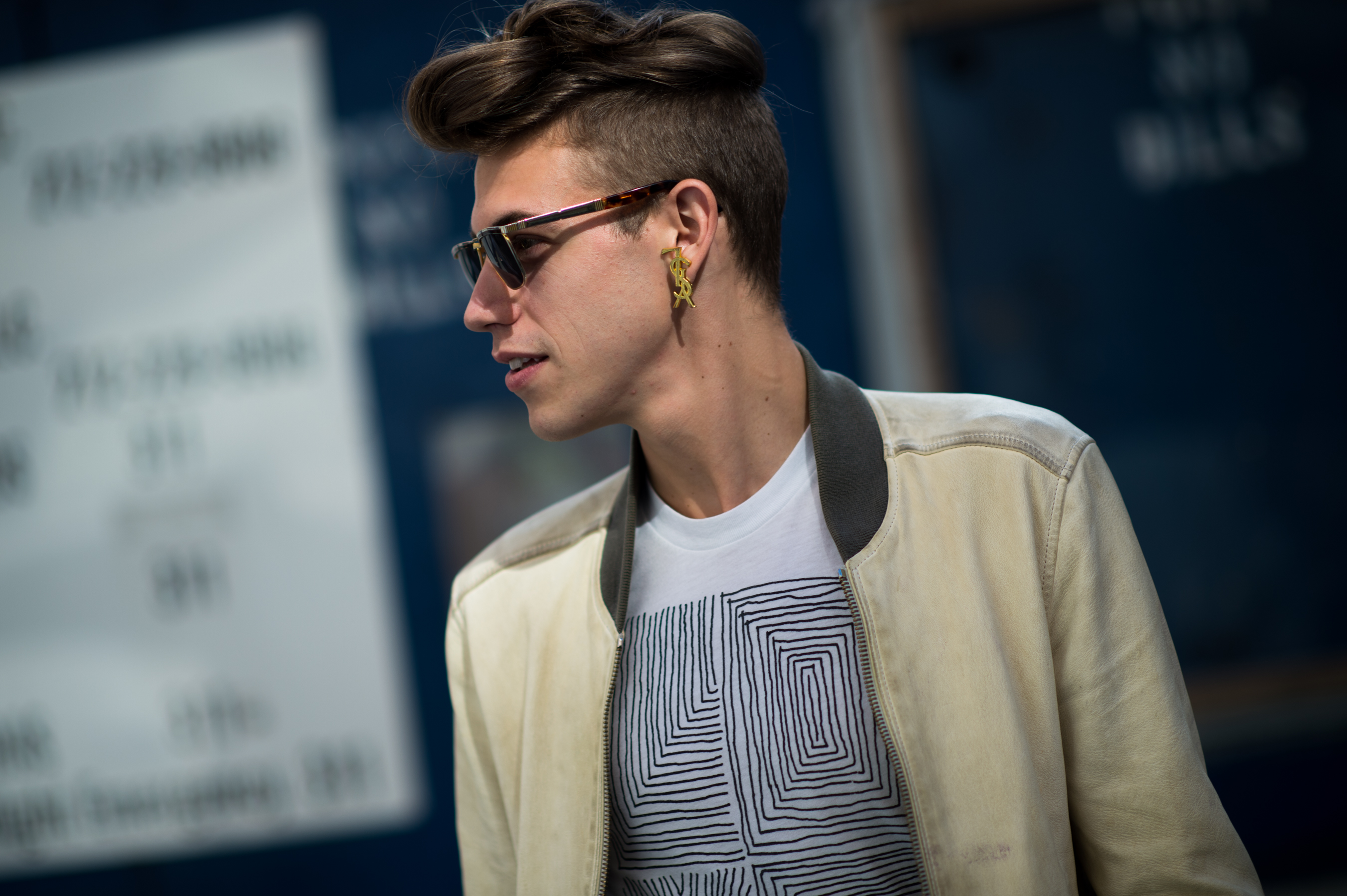 Man wearing sunglasses and YSL earring