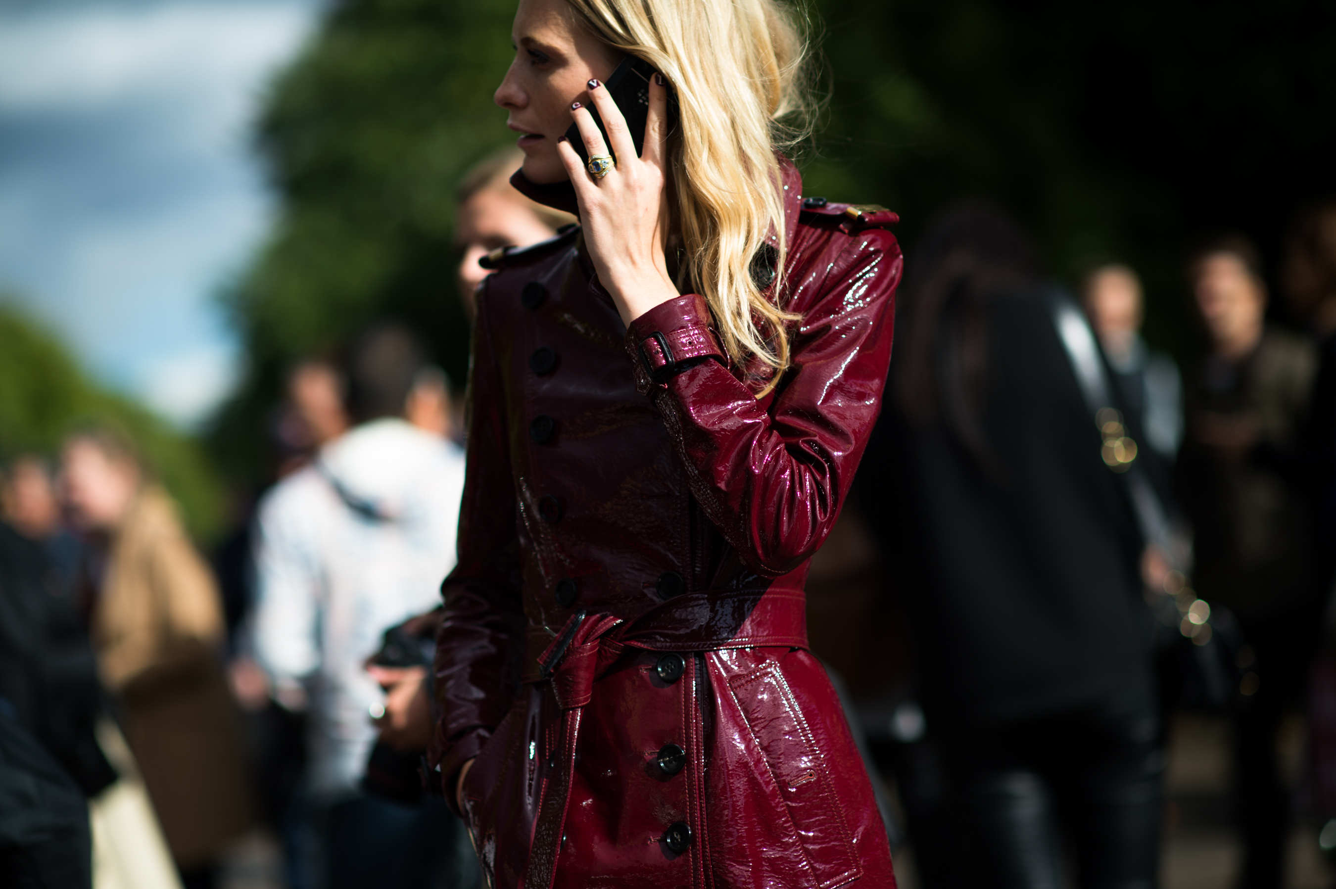 British model wearing red Burberry trench