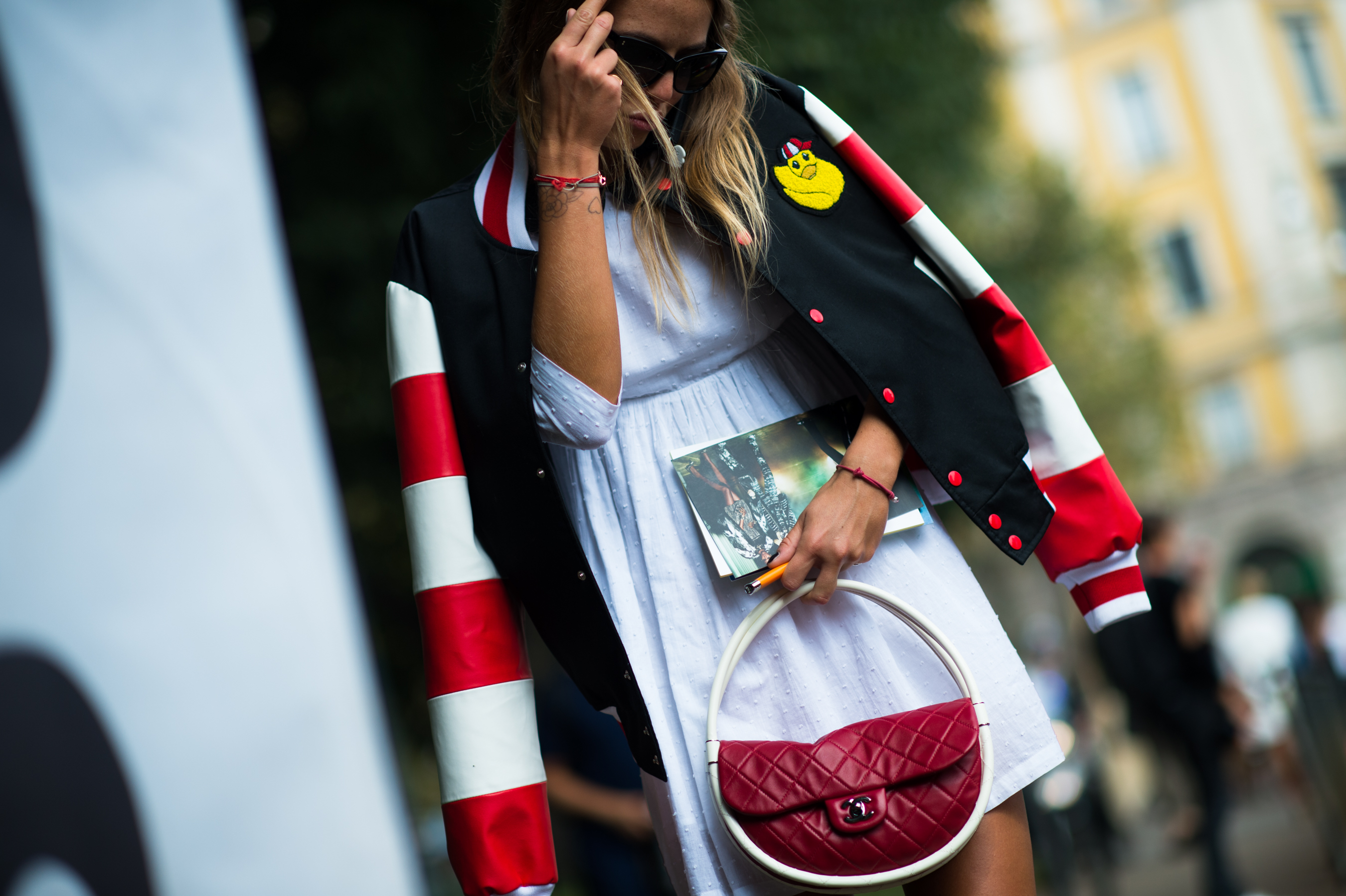 Italian woman wearing red and white jacket