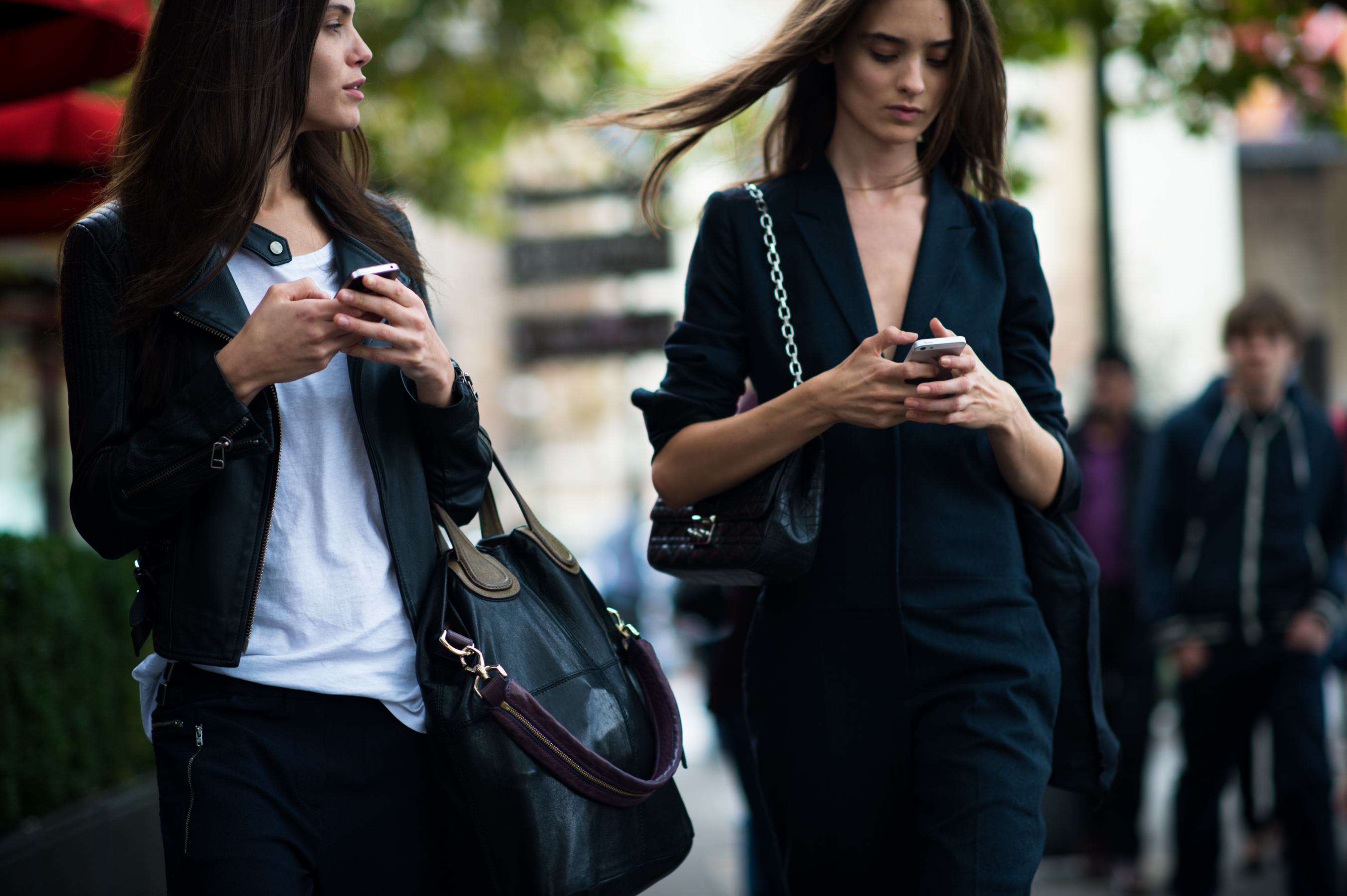 Models after fashion show texting