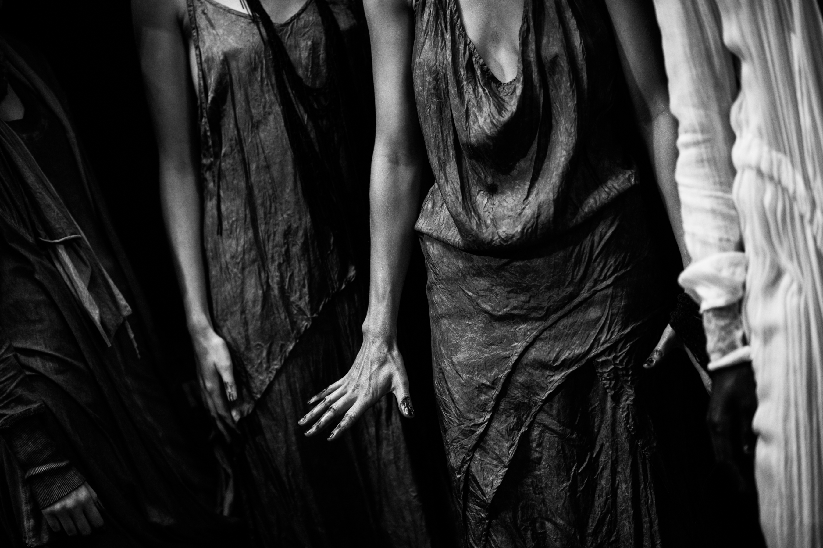 Two models wearing grey silk dresses