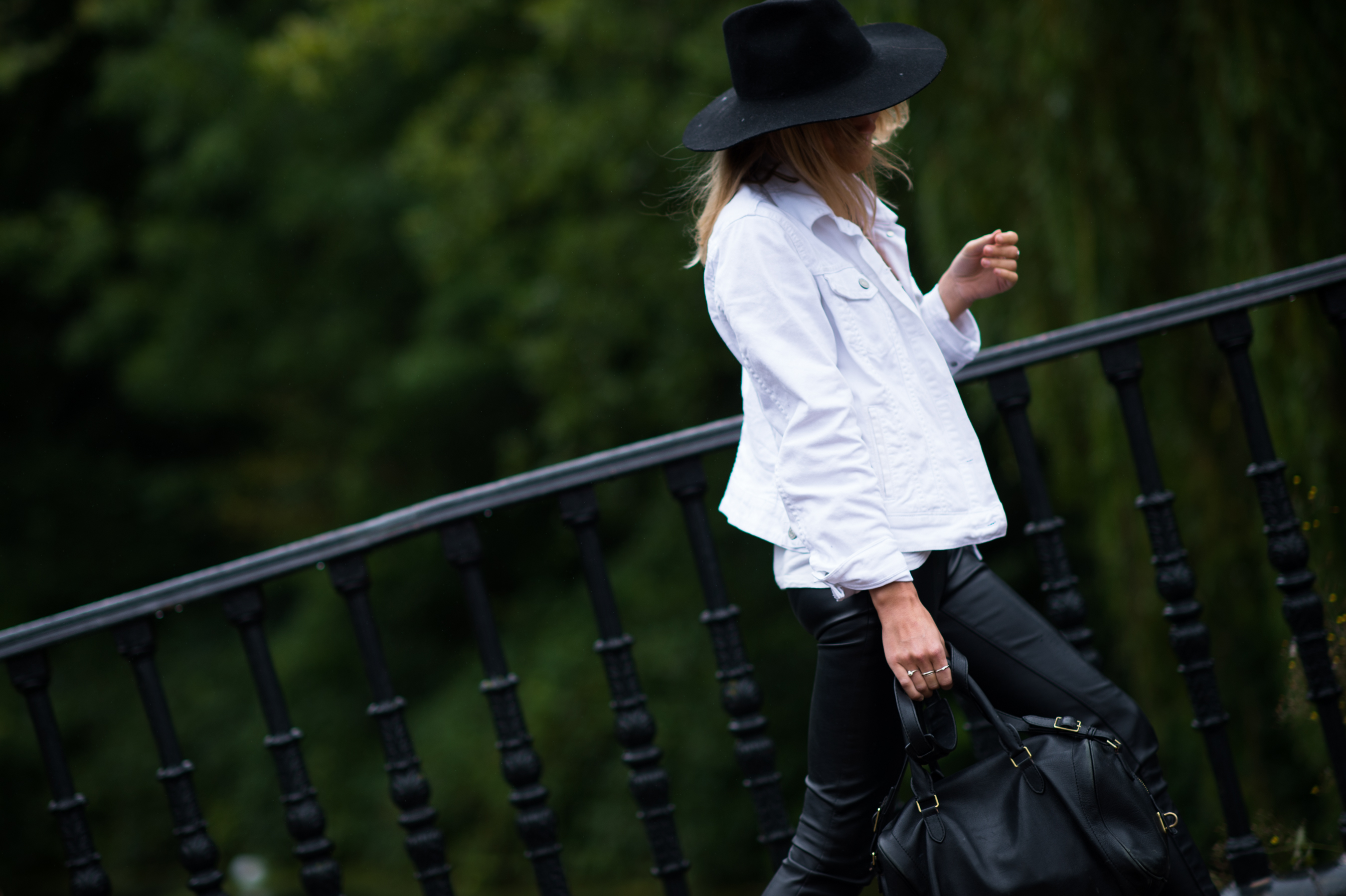 Woman wearing white denim jacket