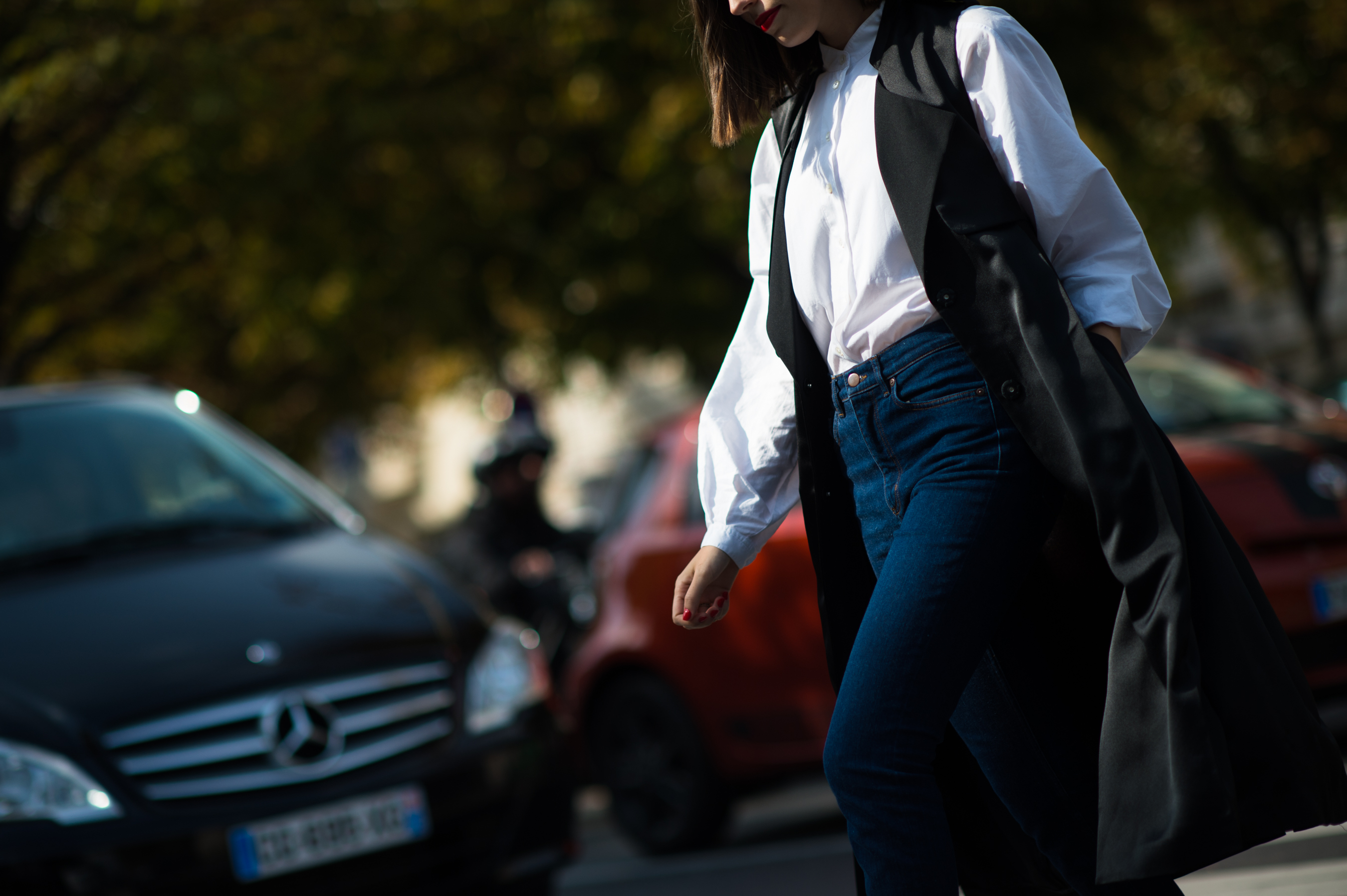 Woman wearing jeans and black waistcoat