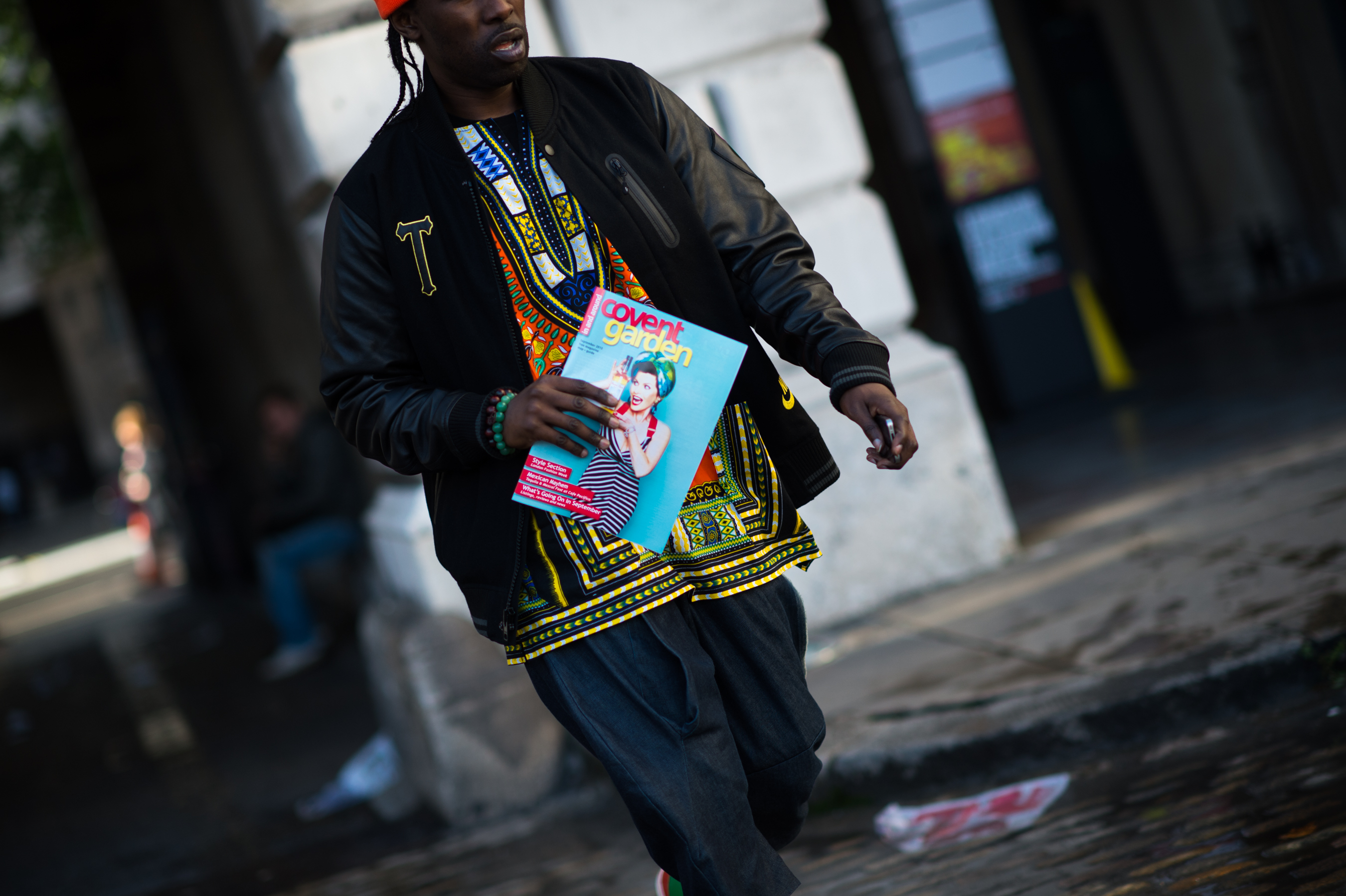 Man wearing leather varsity jacket