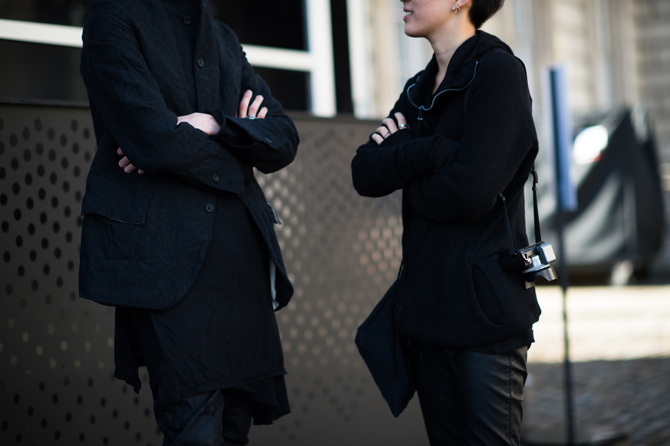 Korean man and woman wearing all black