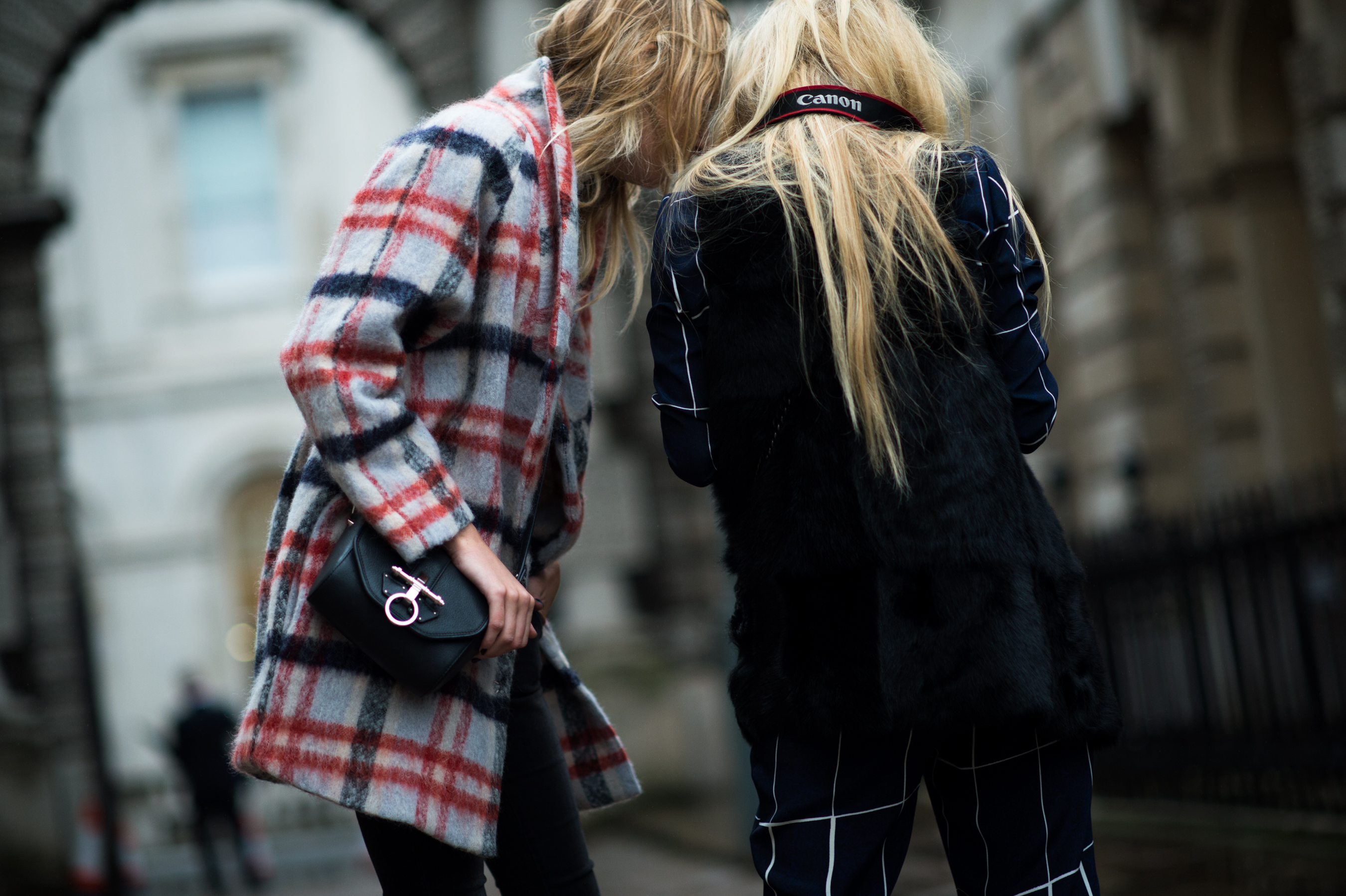 Two bloggers looking at their cameras