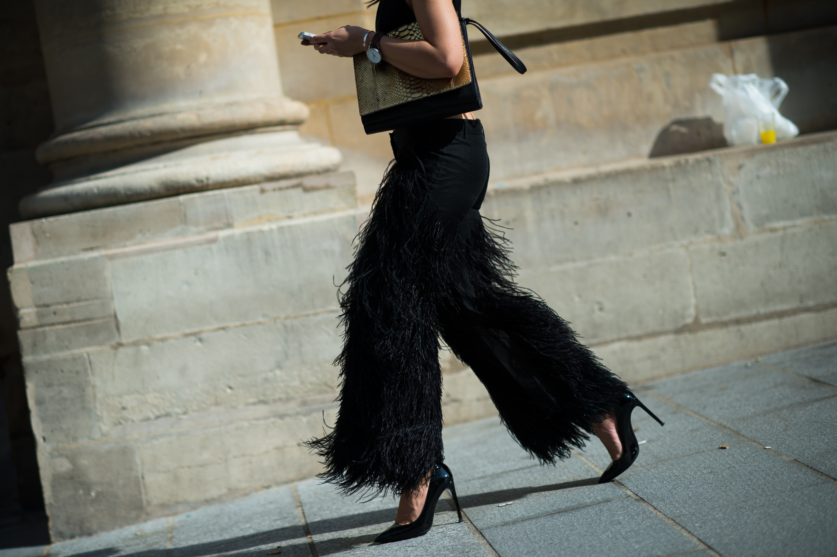 Norwegian woman wearing black feather pants