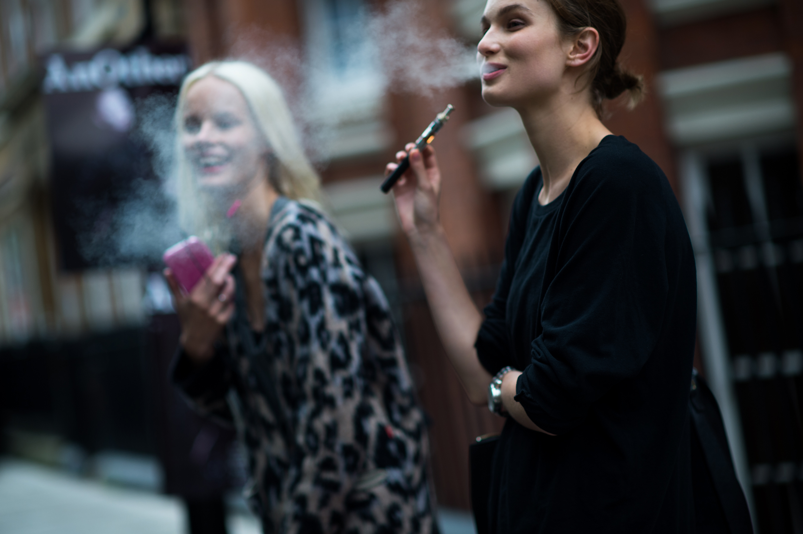 Models smoking after fashion show