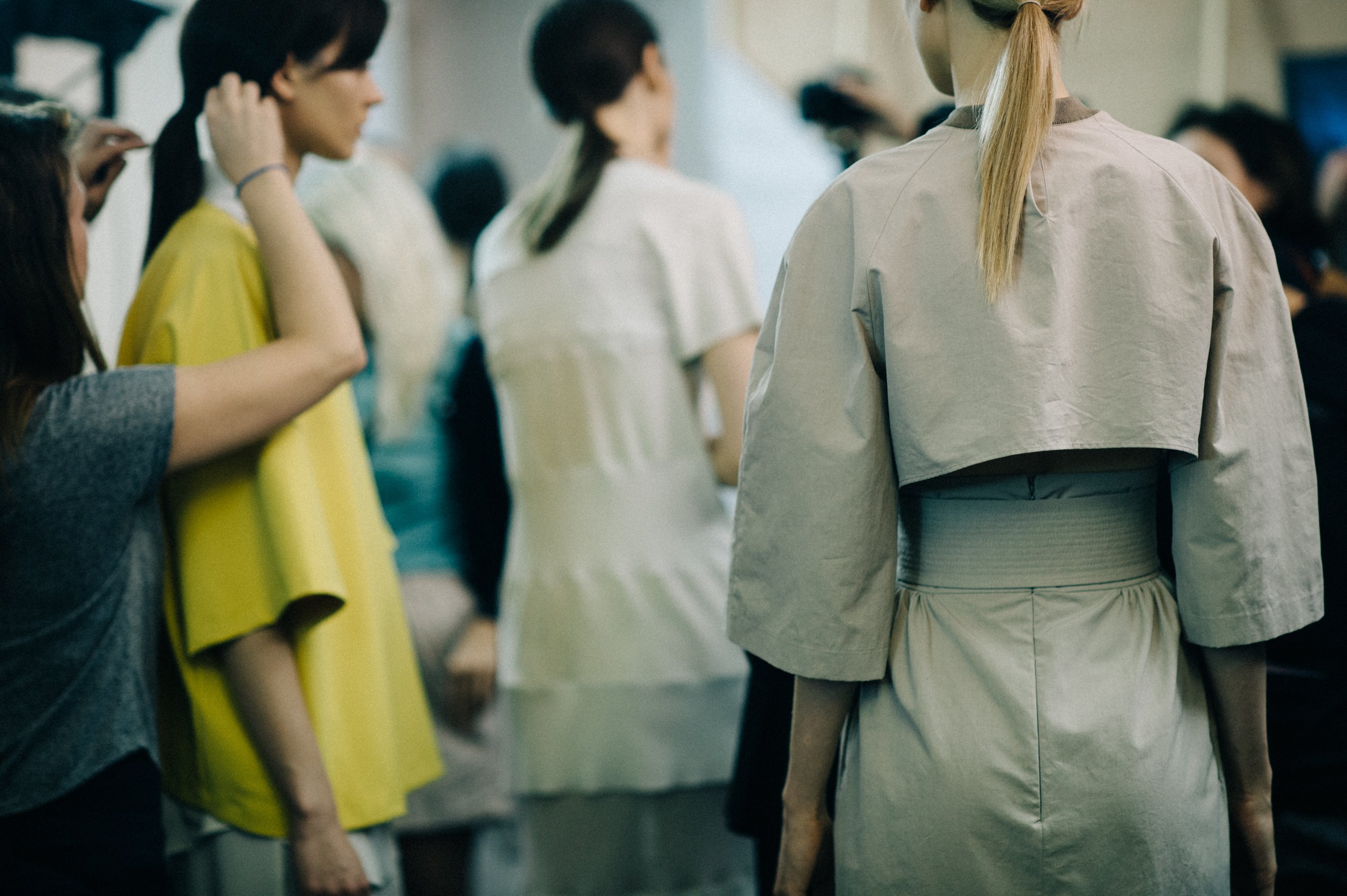 Model wearing high back trench