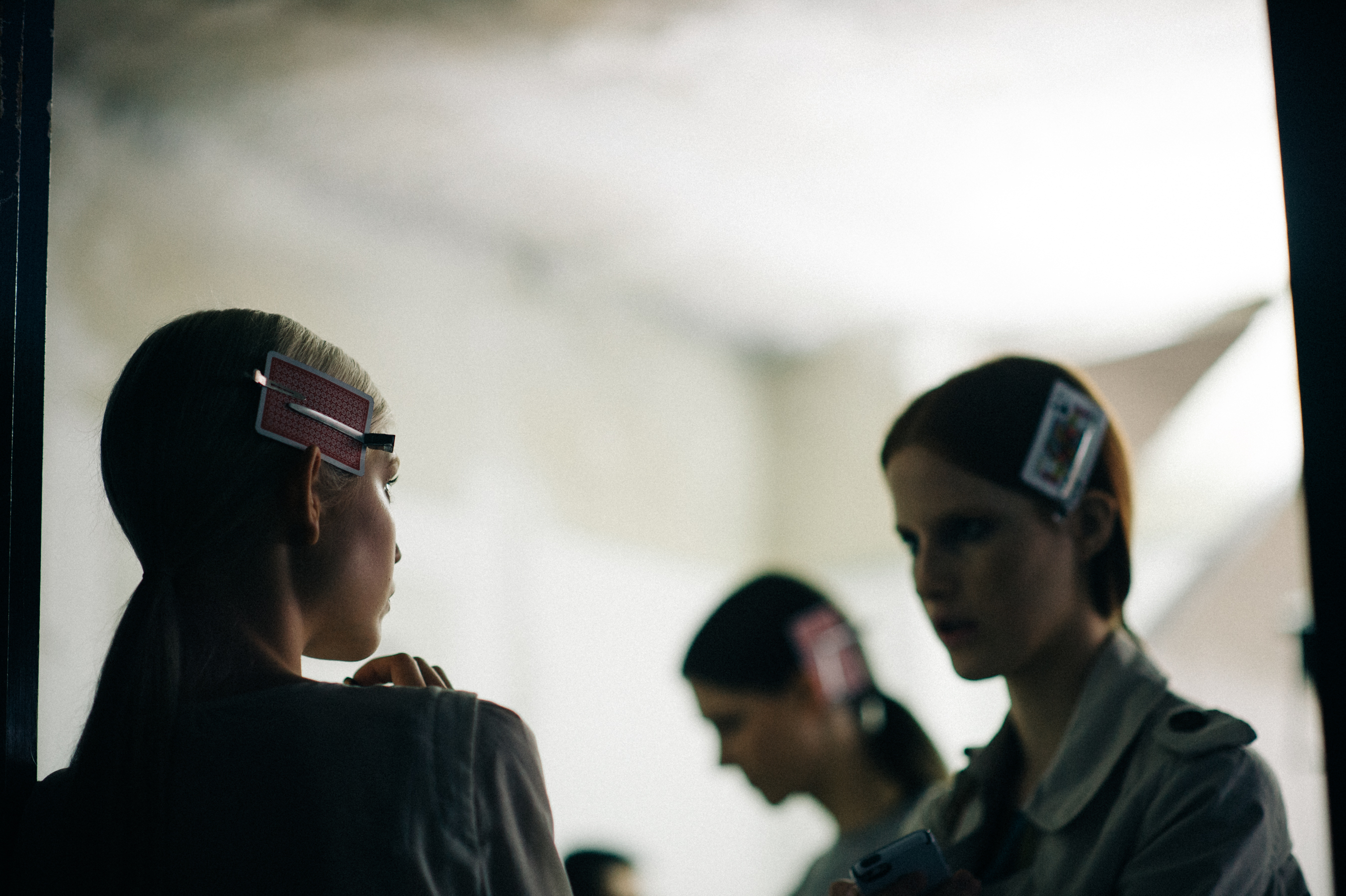 Three models talking before show