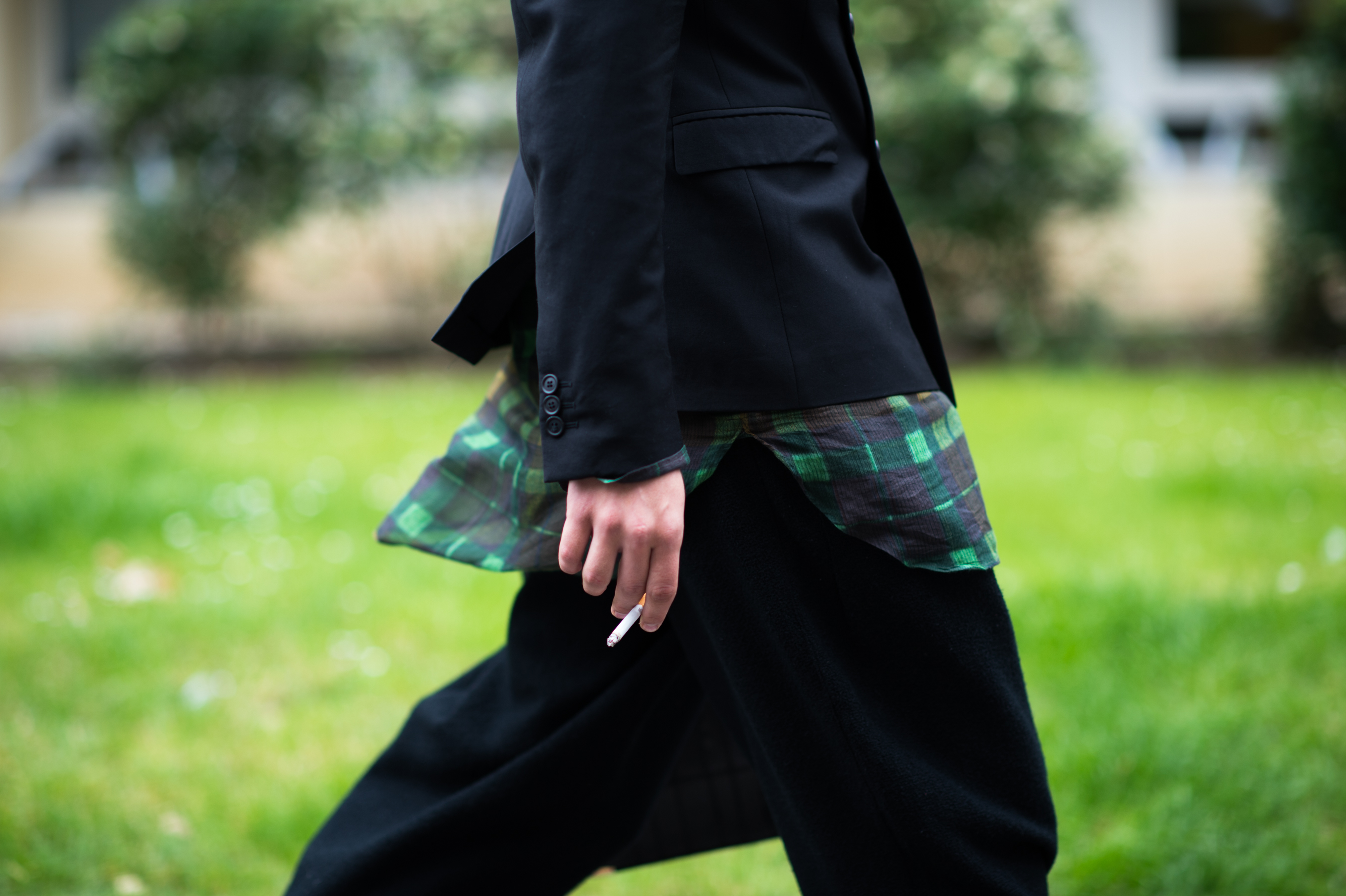 French stylist wearing black and green