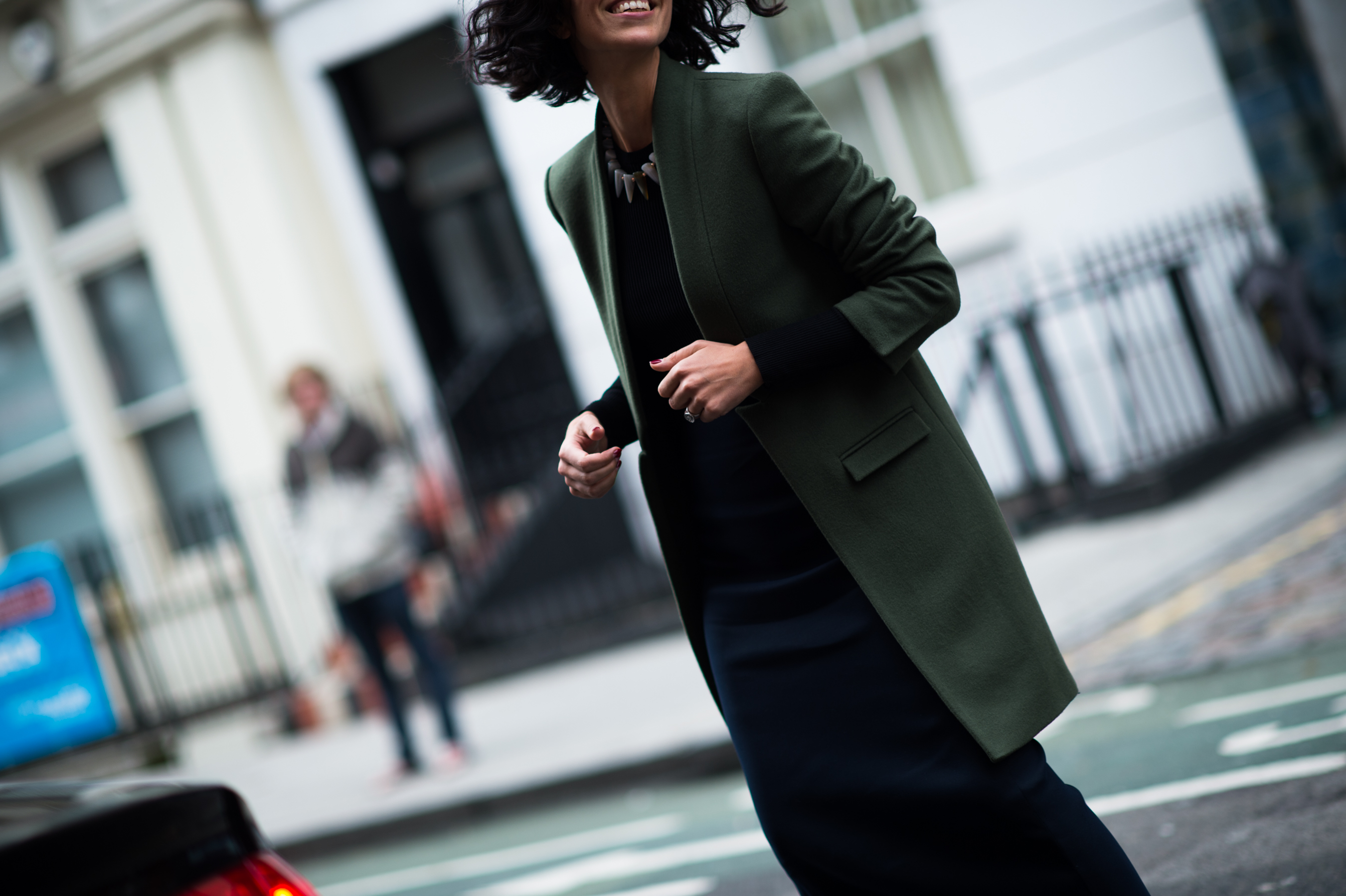 Stylist wearing army green coat