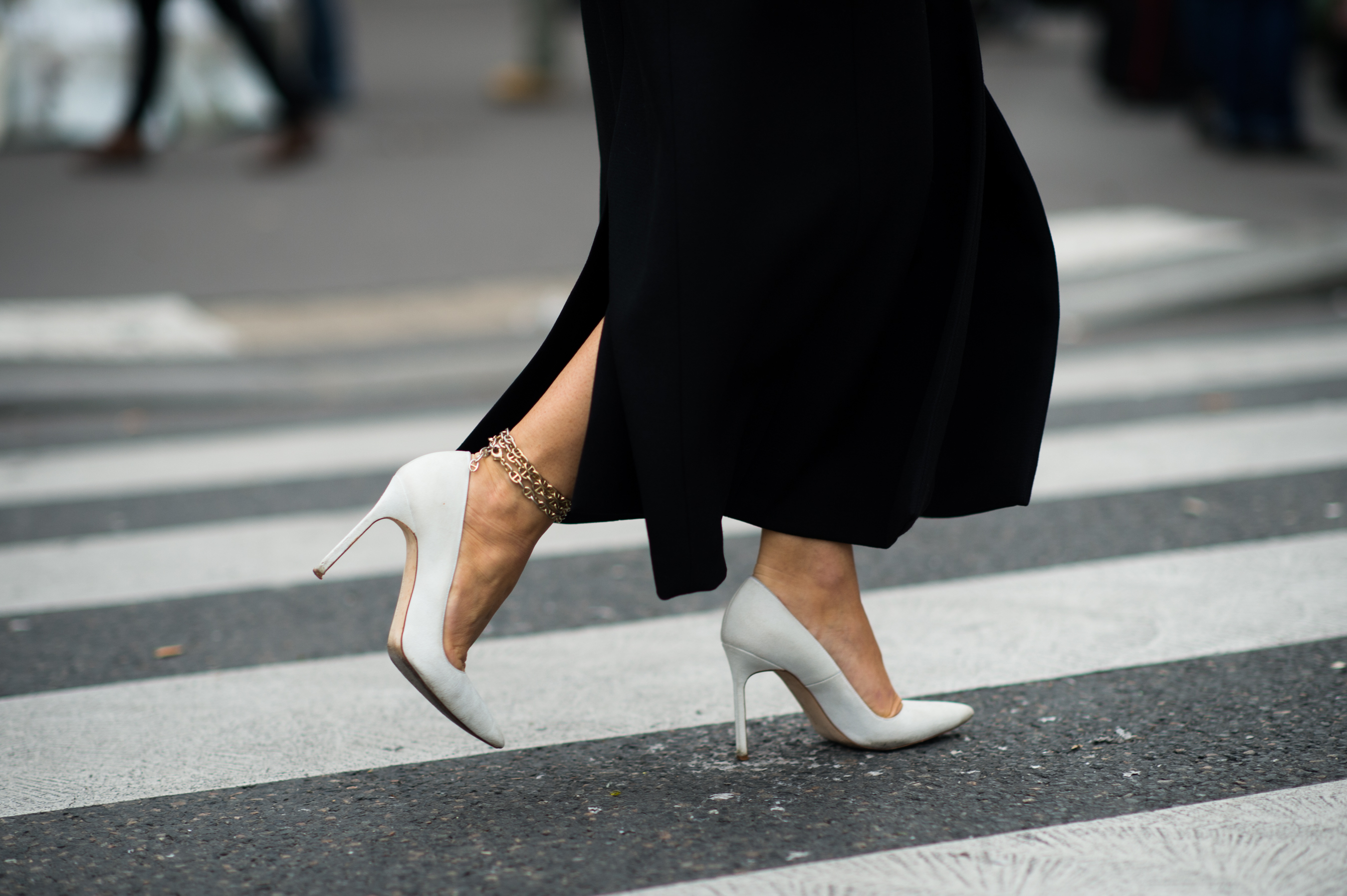 Woman wearing white high heel shoes