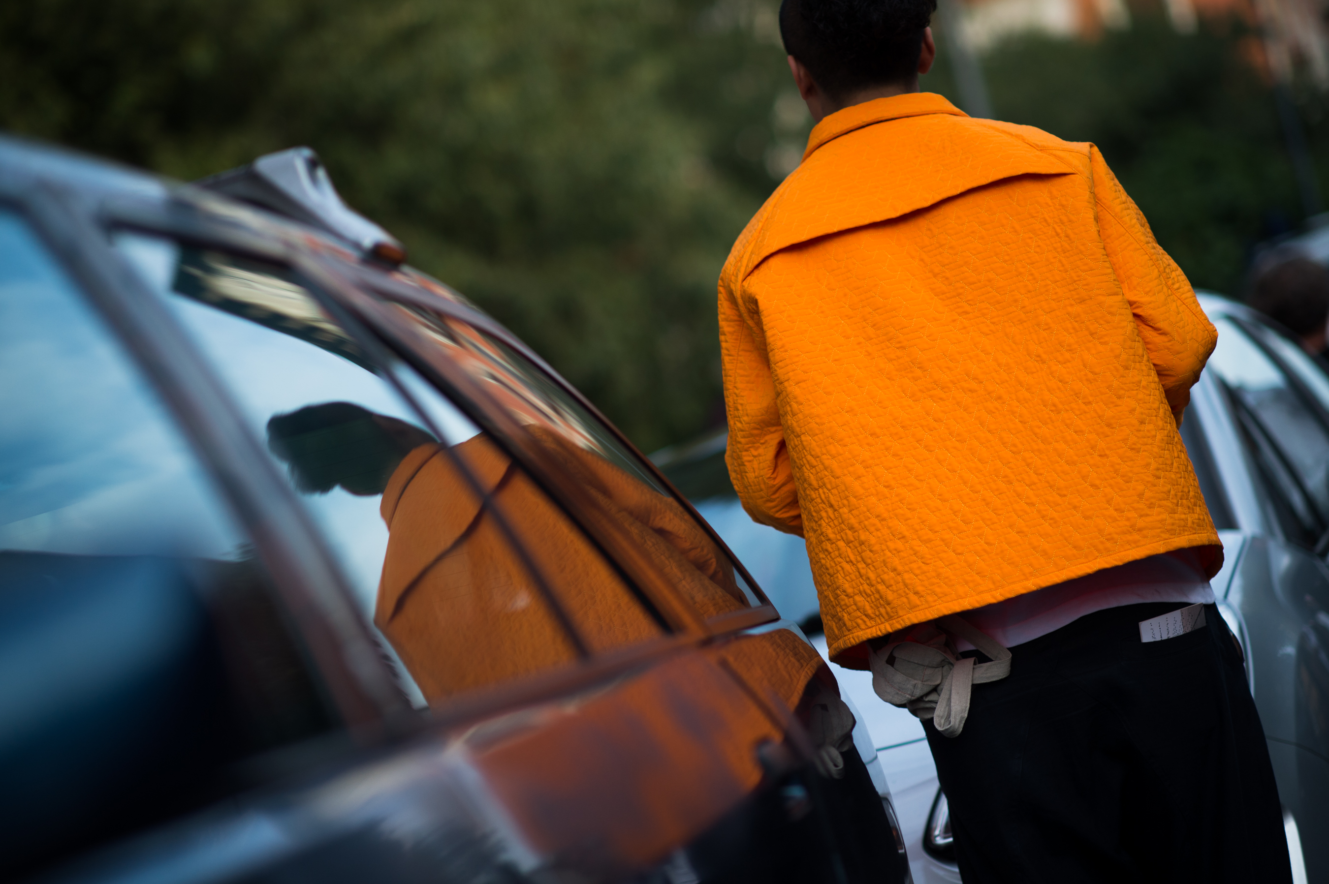 Chinese man wearing Orange jacket