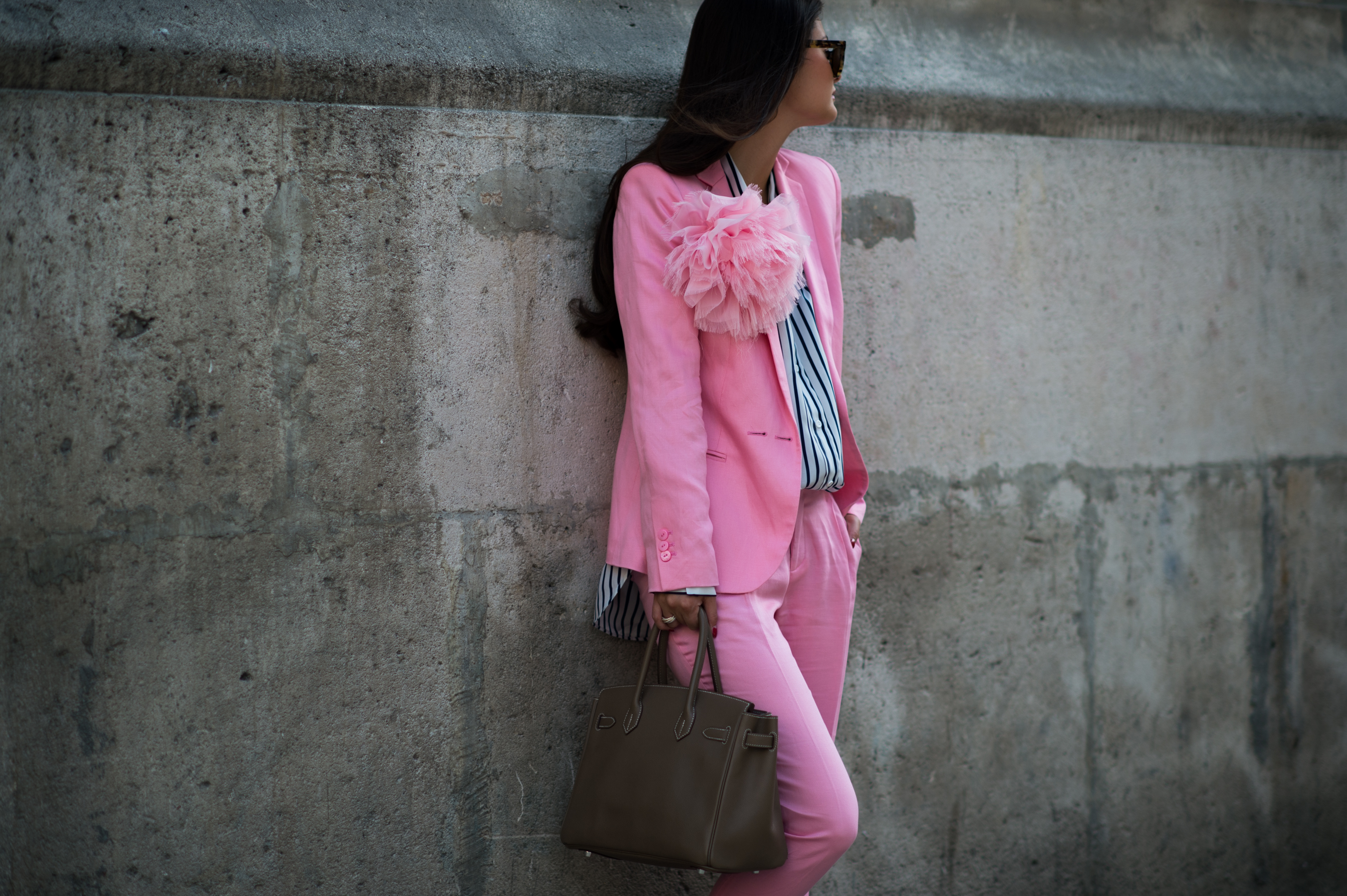 Blogger wearing pink suit and Birkin bag