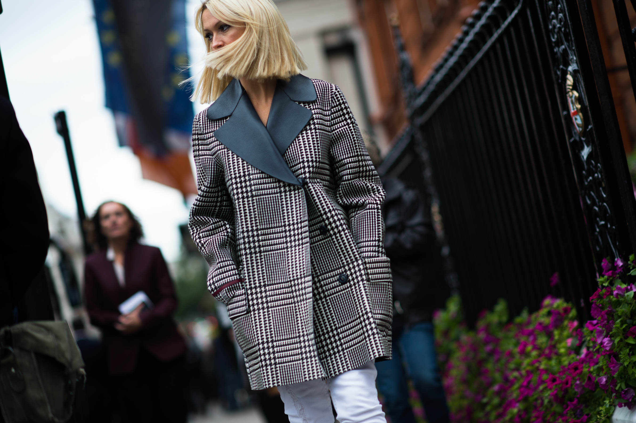 Blonde woman wearing prince of wales jacket