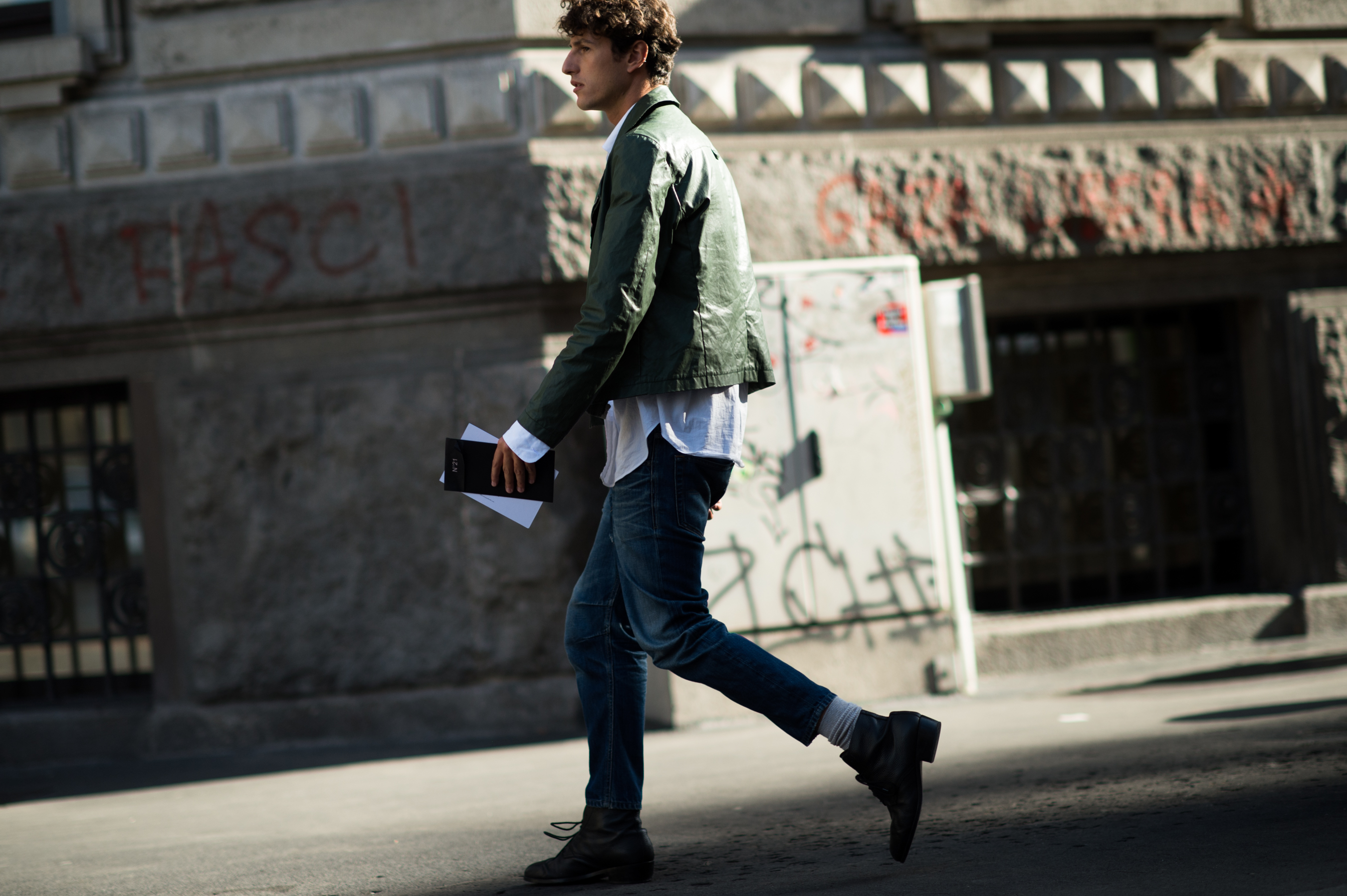Italian Elle editor wearing green leather jacket