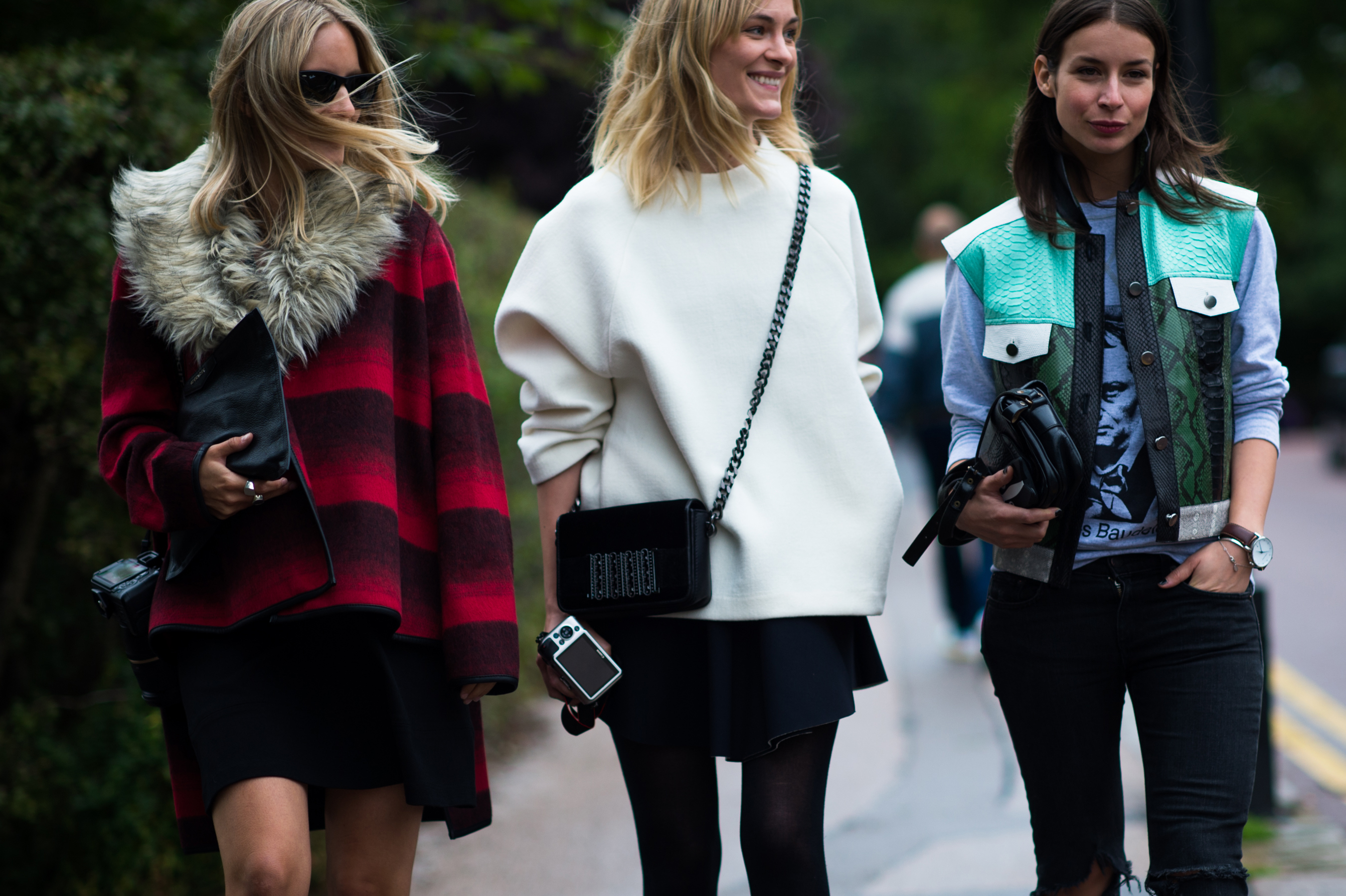 Three bloggers walking on street