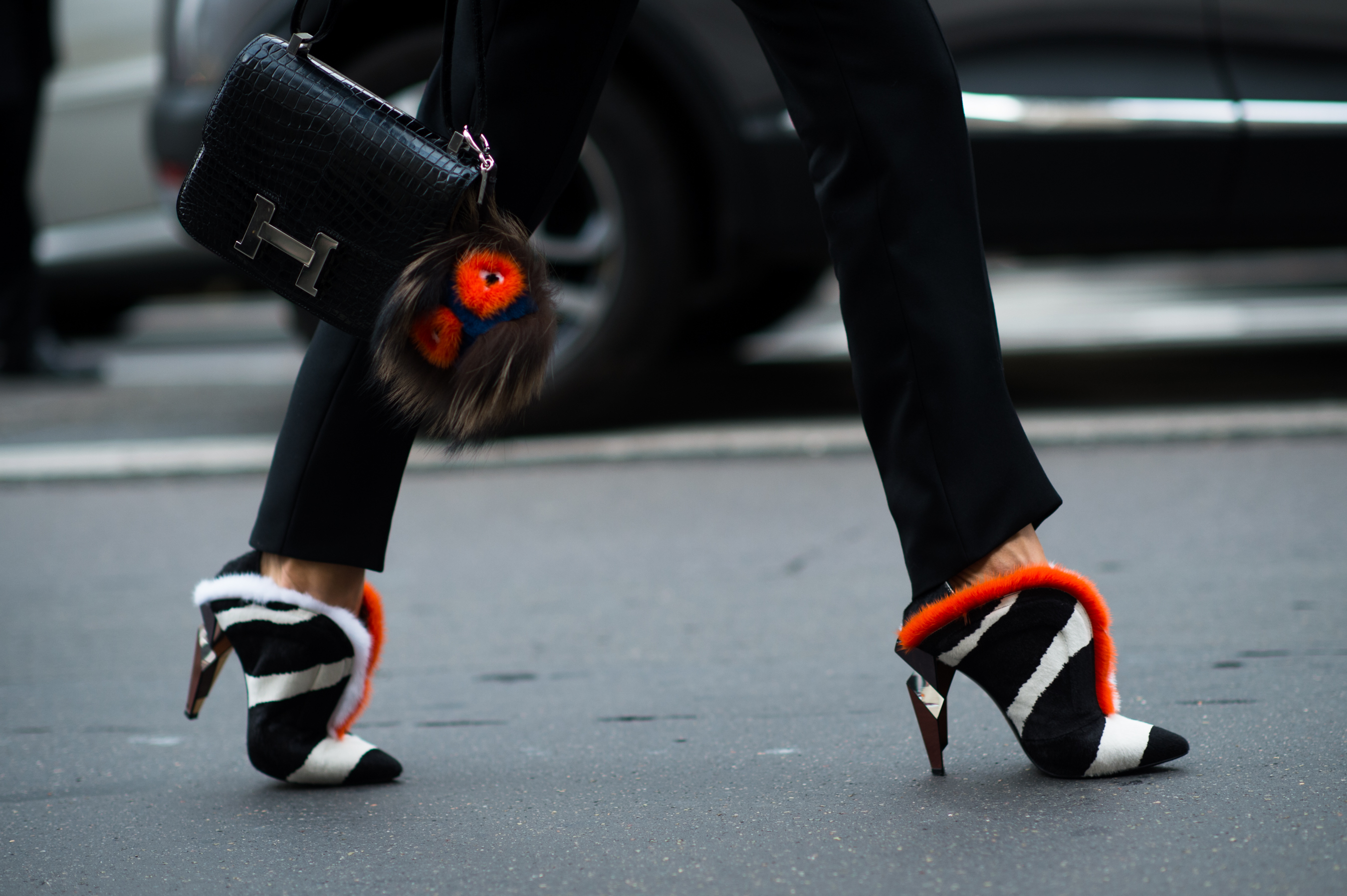 Woman wearing fur Fendi shoes and Furry friend