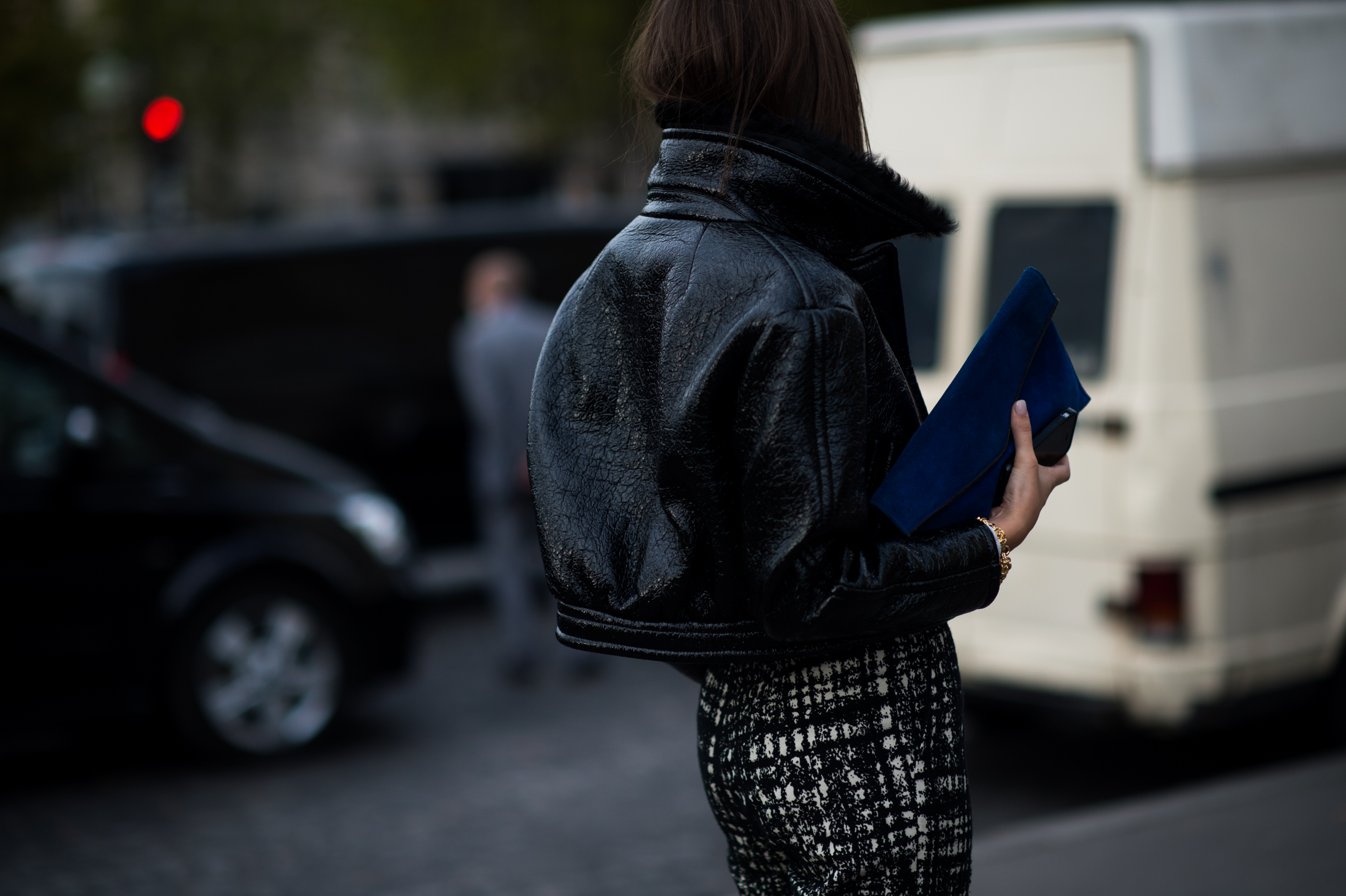 Girl wearing structured patent leather jacket