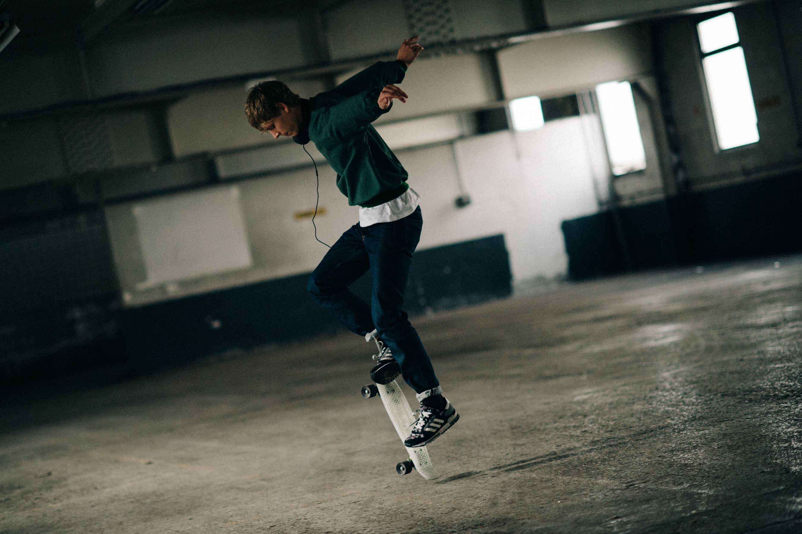 Male model skateboarding before fashion show