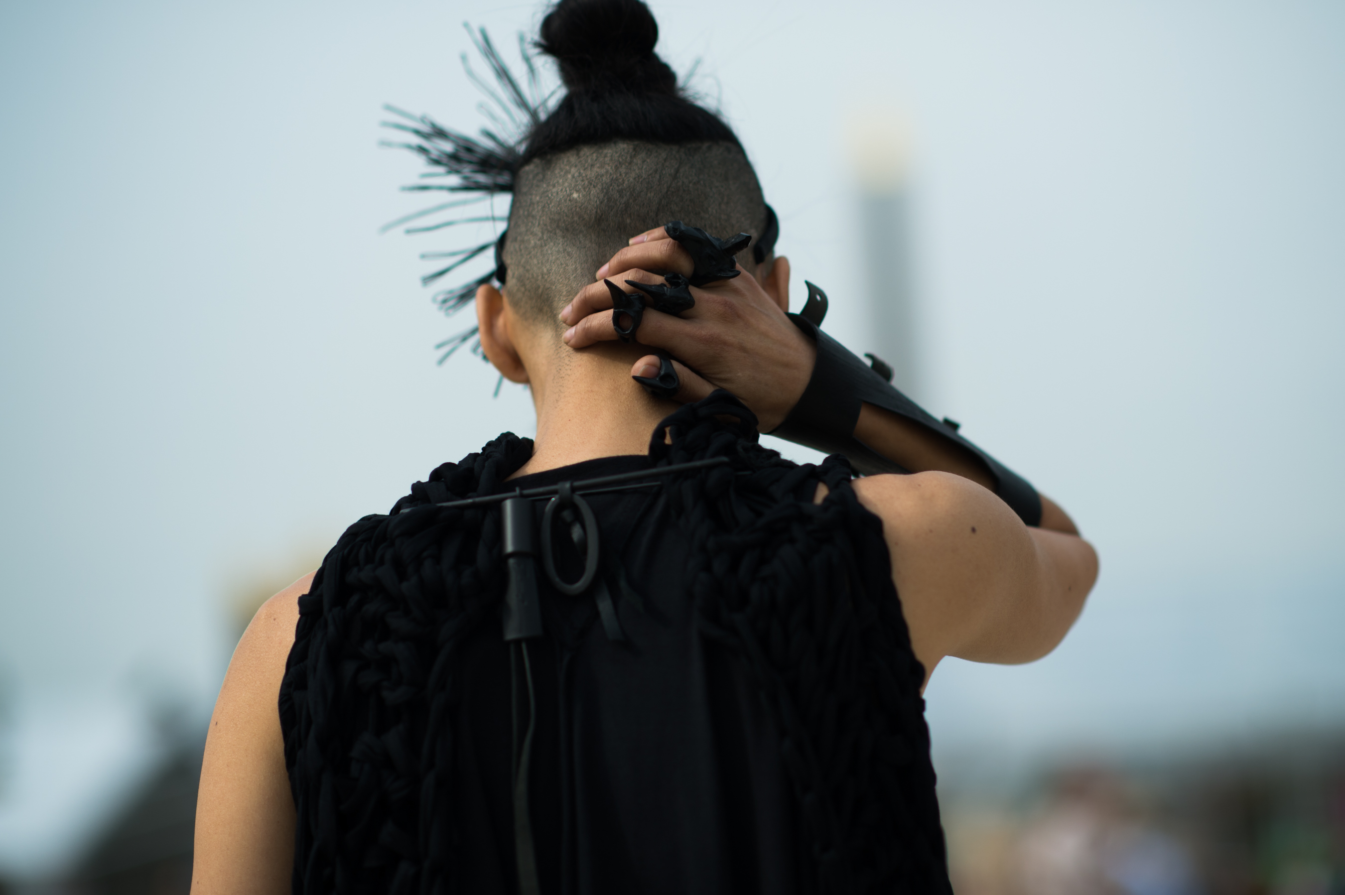 Woman wearing all black with rings