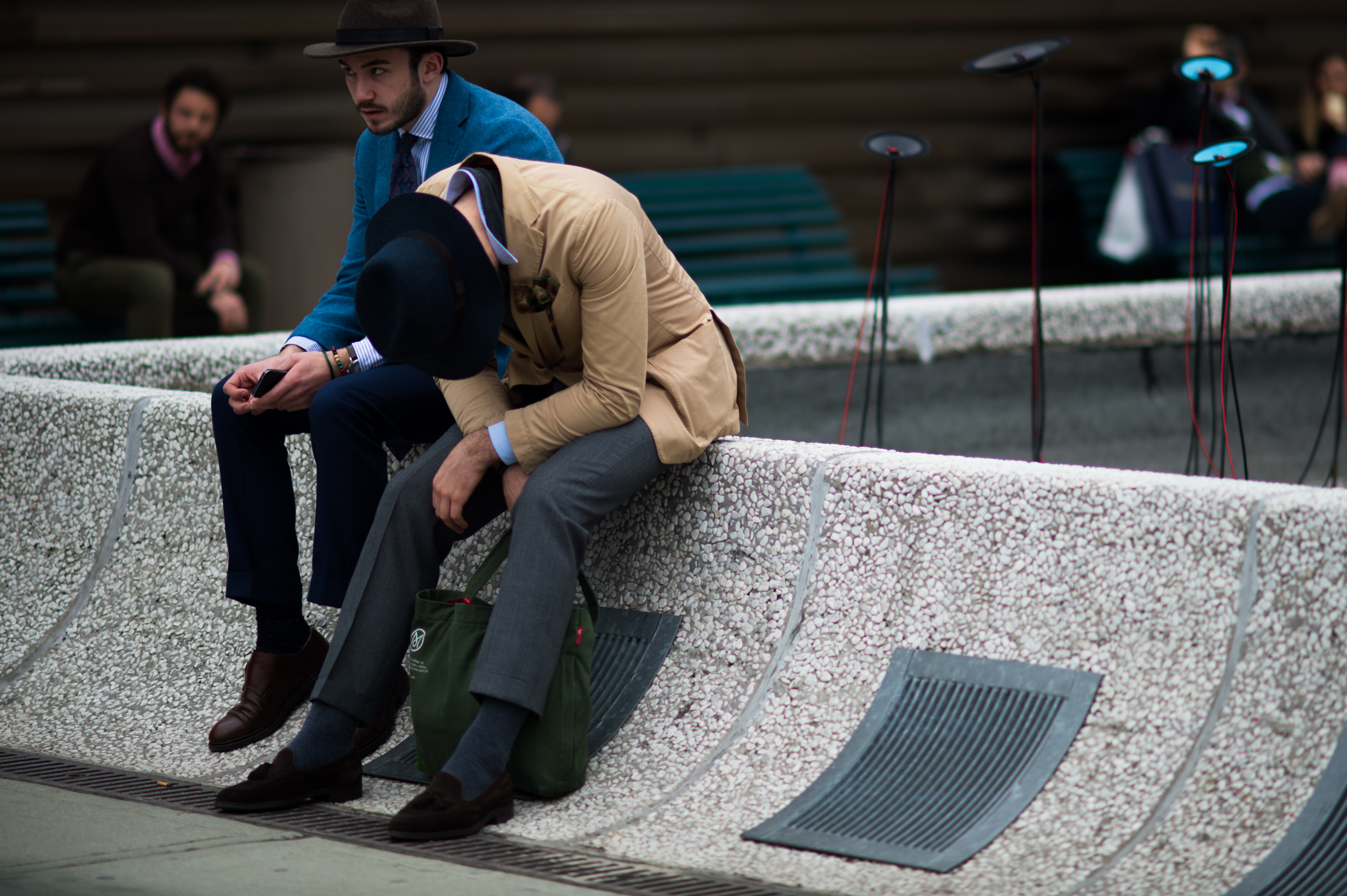 Two men wearing suits and hats