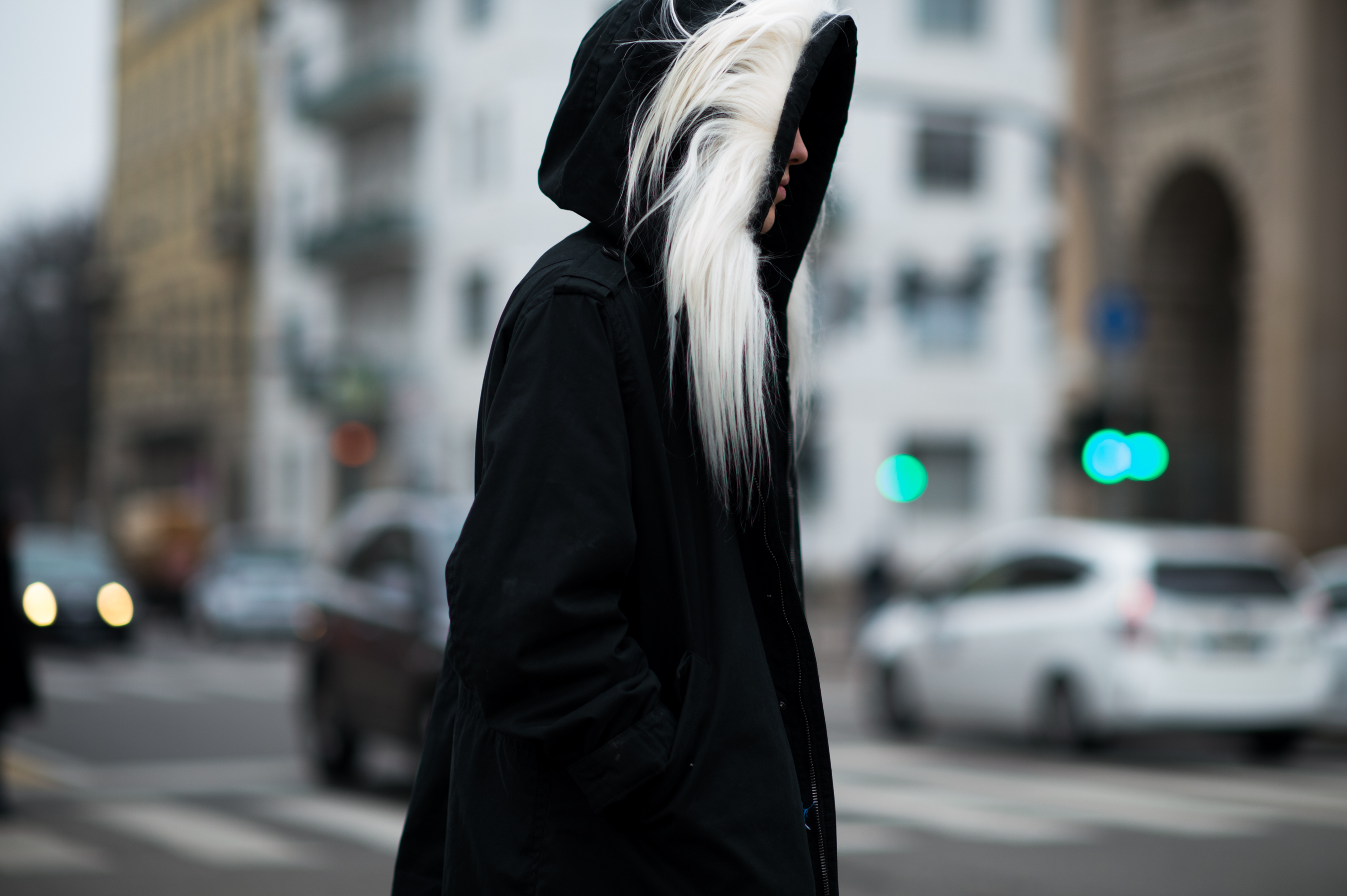 Man wearing coat with fur hood