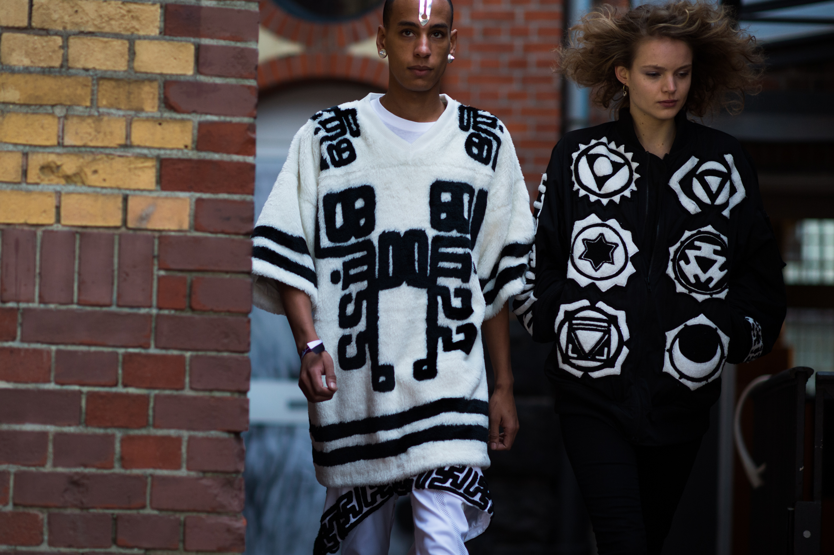 Man and woman wearing full KTZ