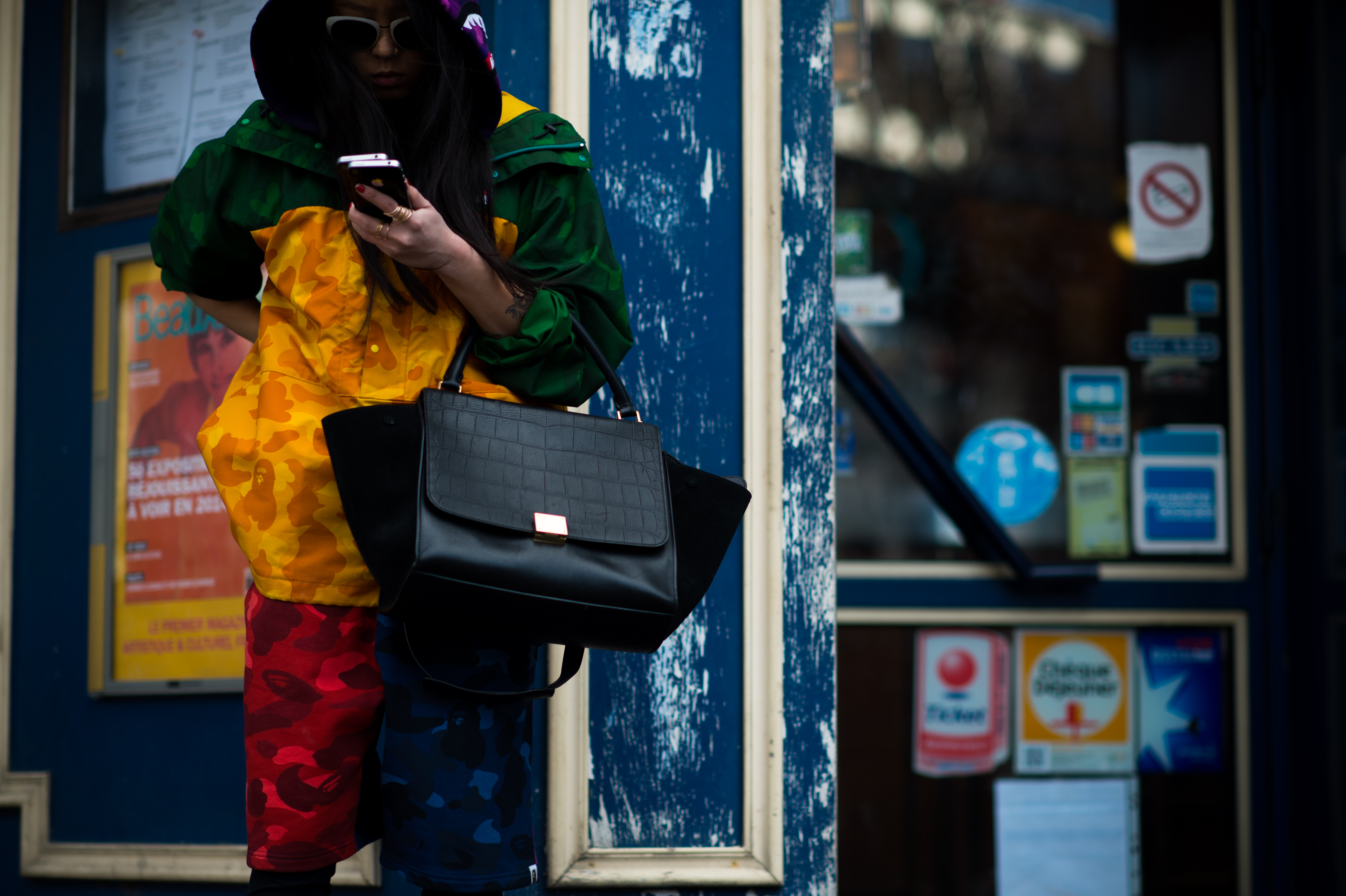 Girl wearing bright colours texting