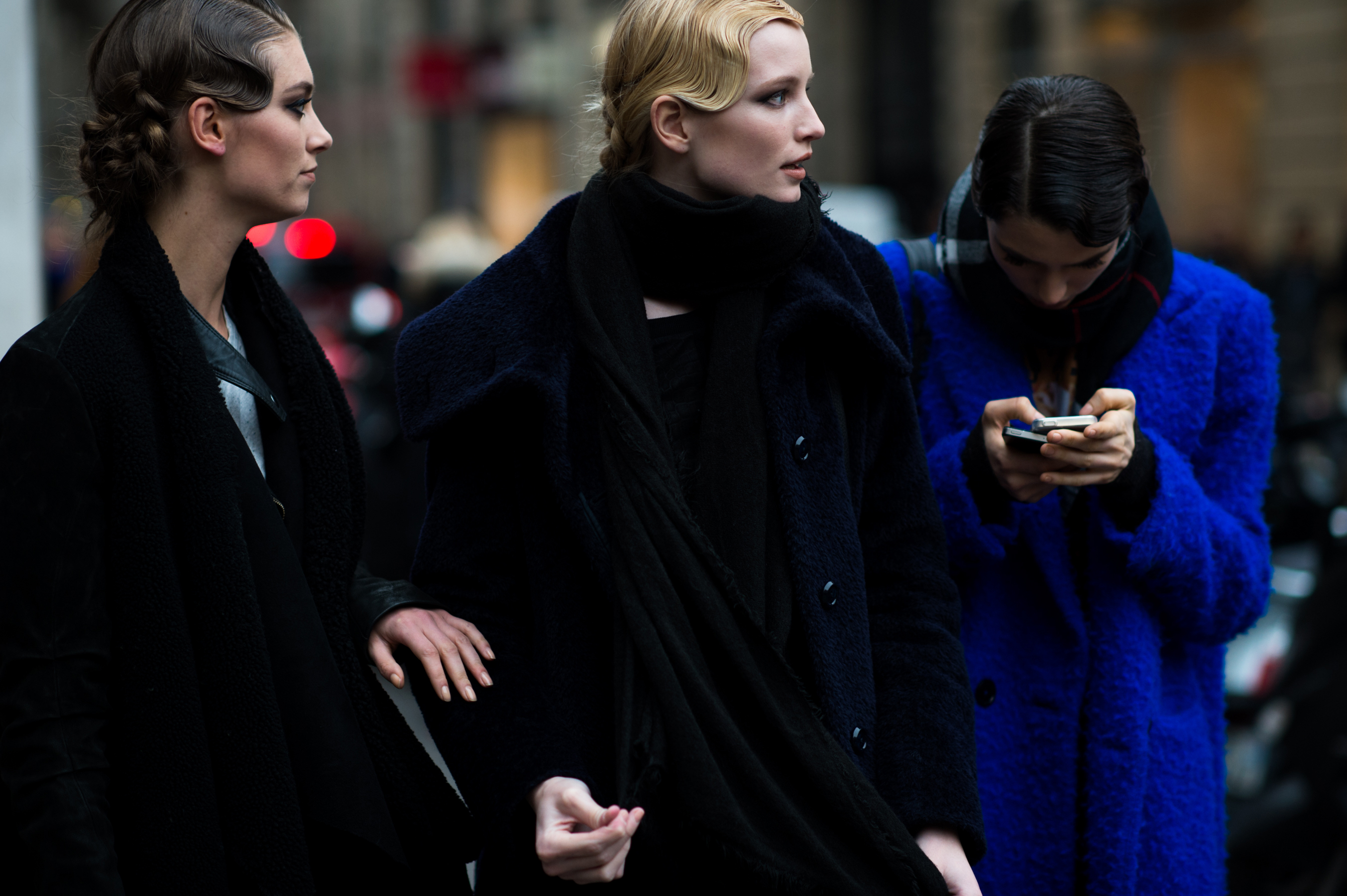 Three models talking after fashion show