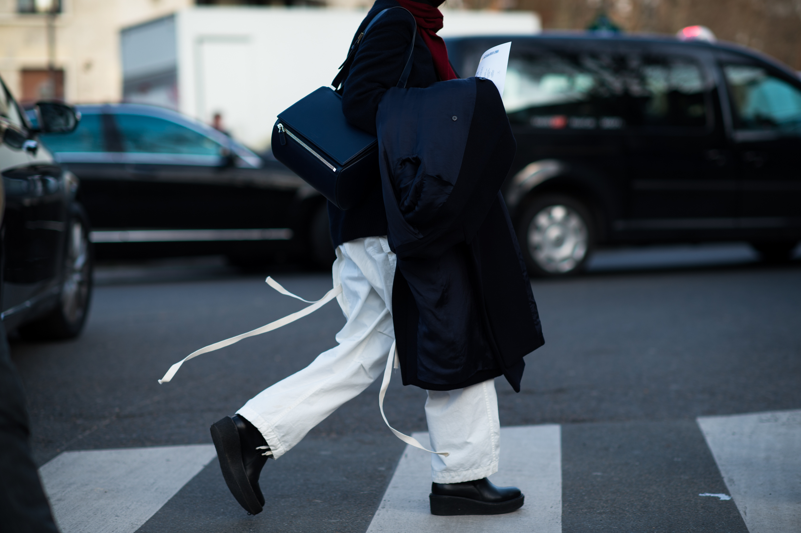 Woman wearing white pants