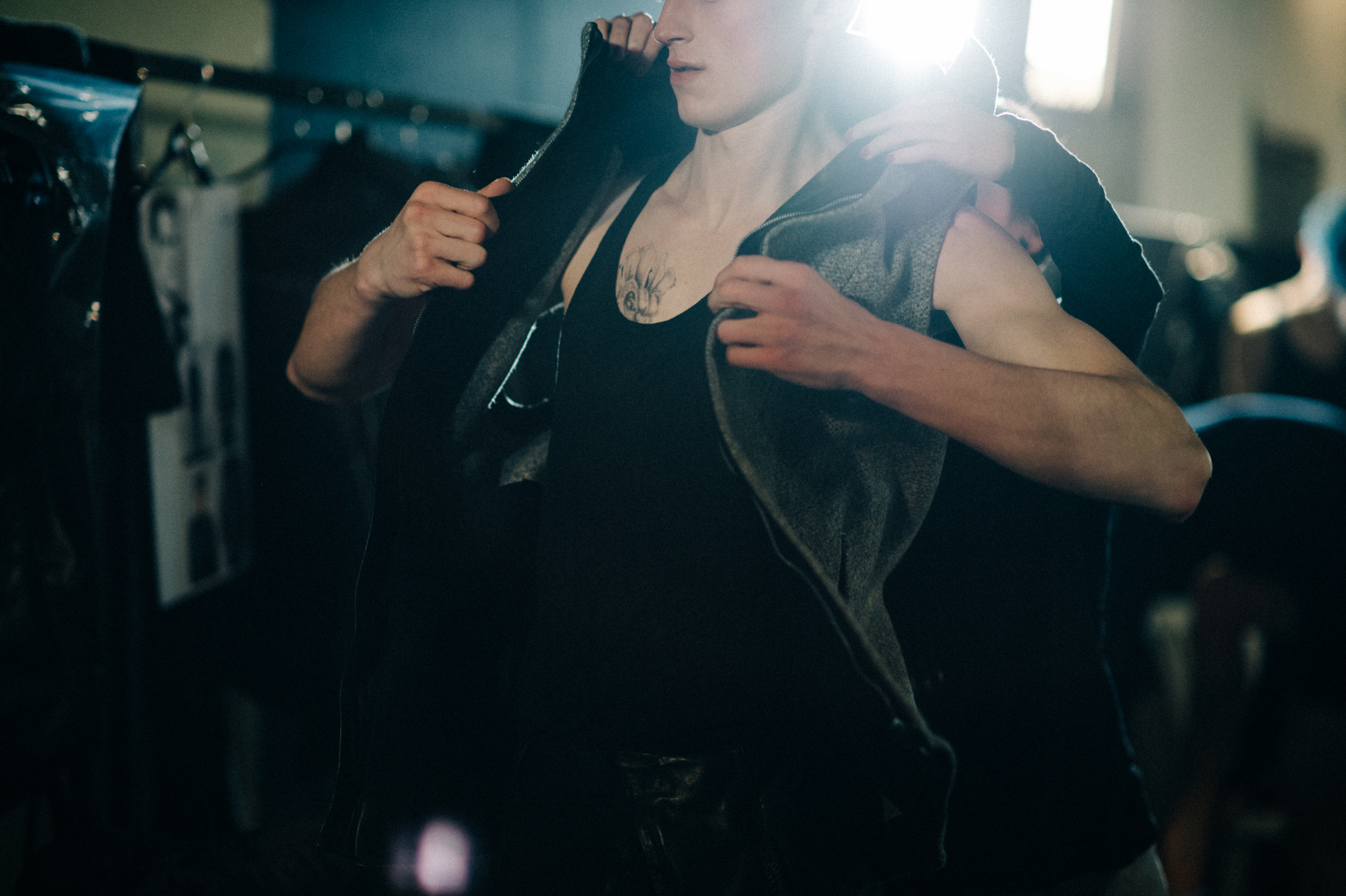 Male model putting on his jacket