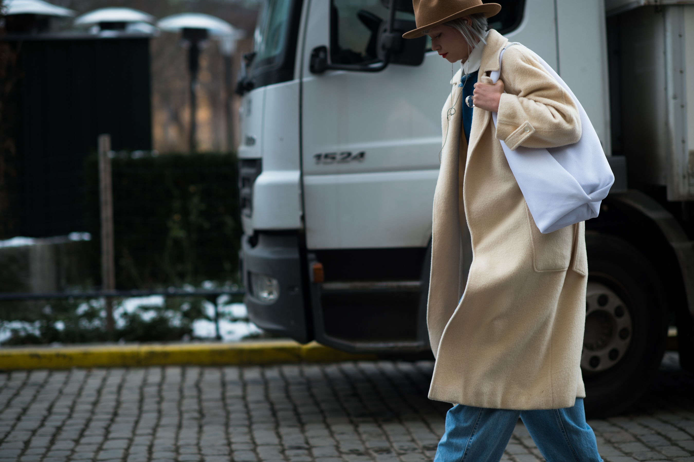 Woman wearing Vivienne Westwood hat and camel coat