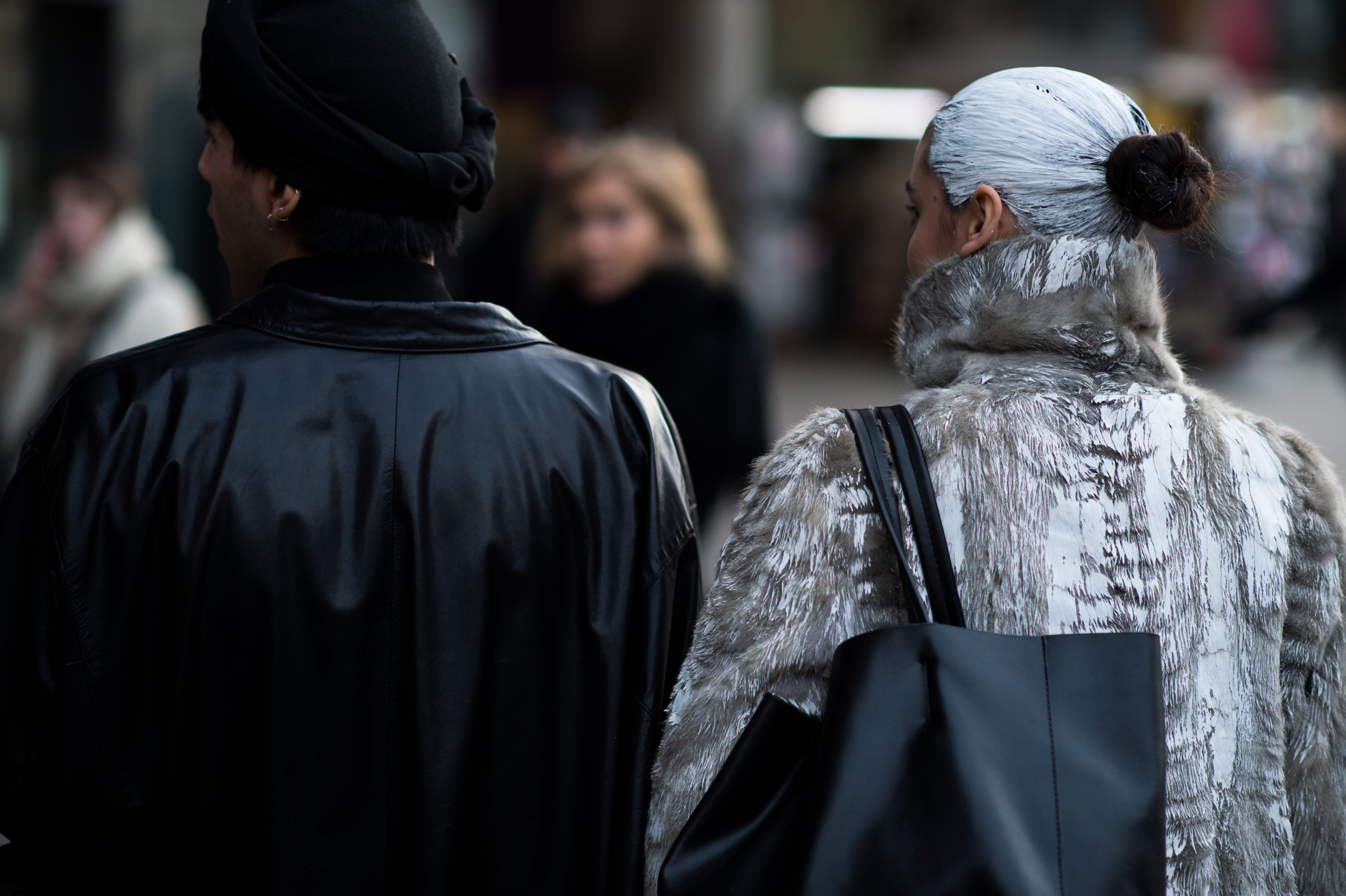 Woman with white painted hair and coat