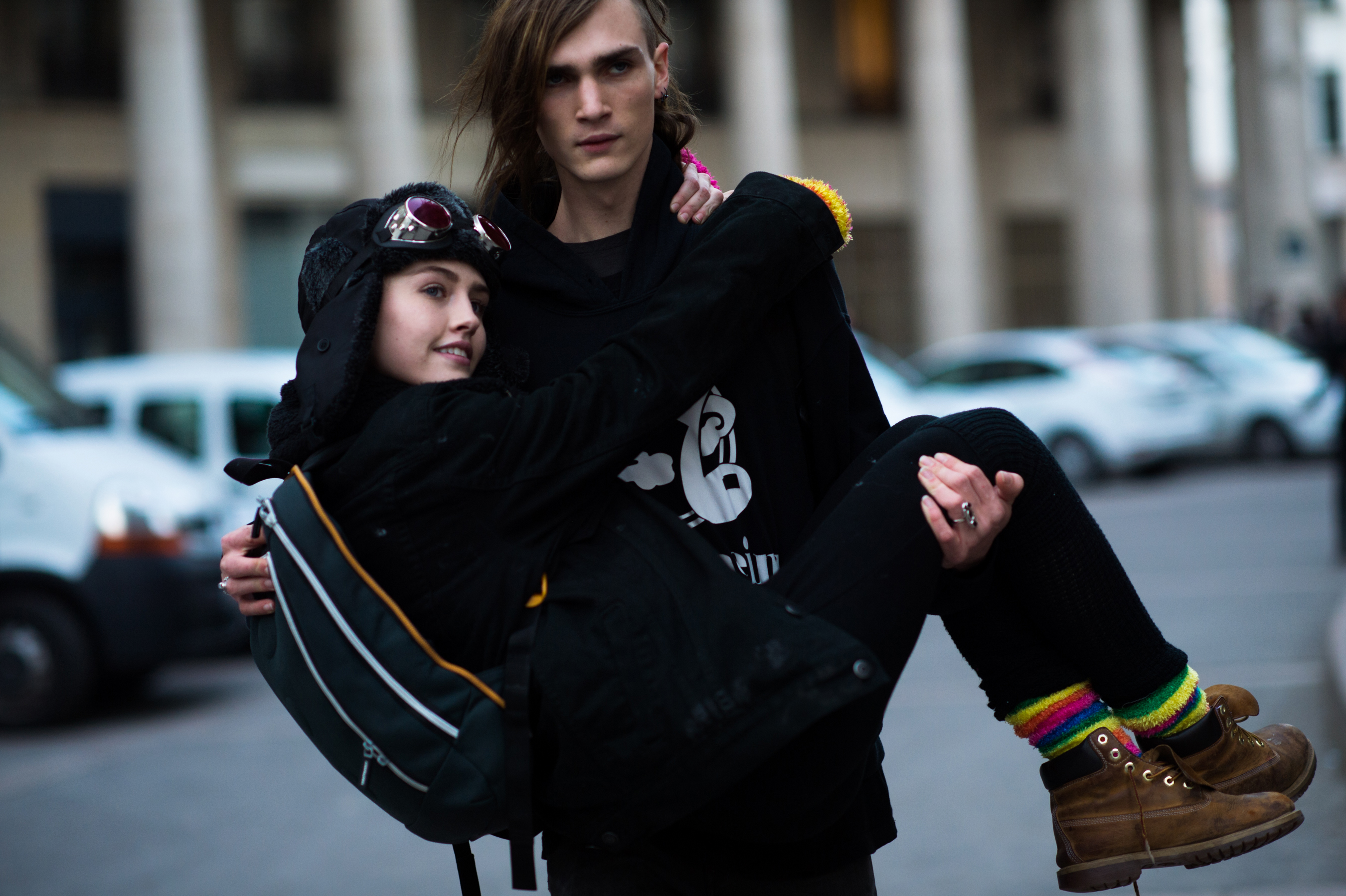 Male model carrying his girlfriend