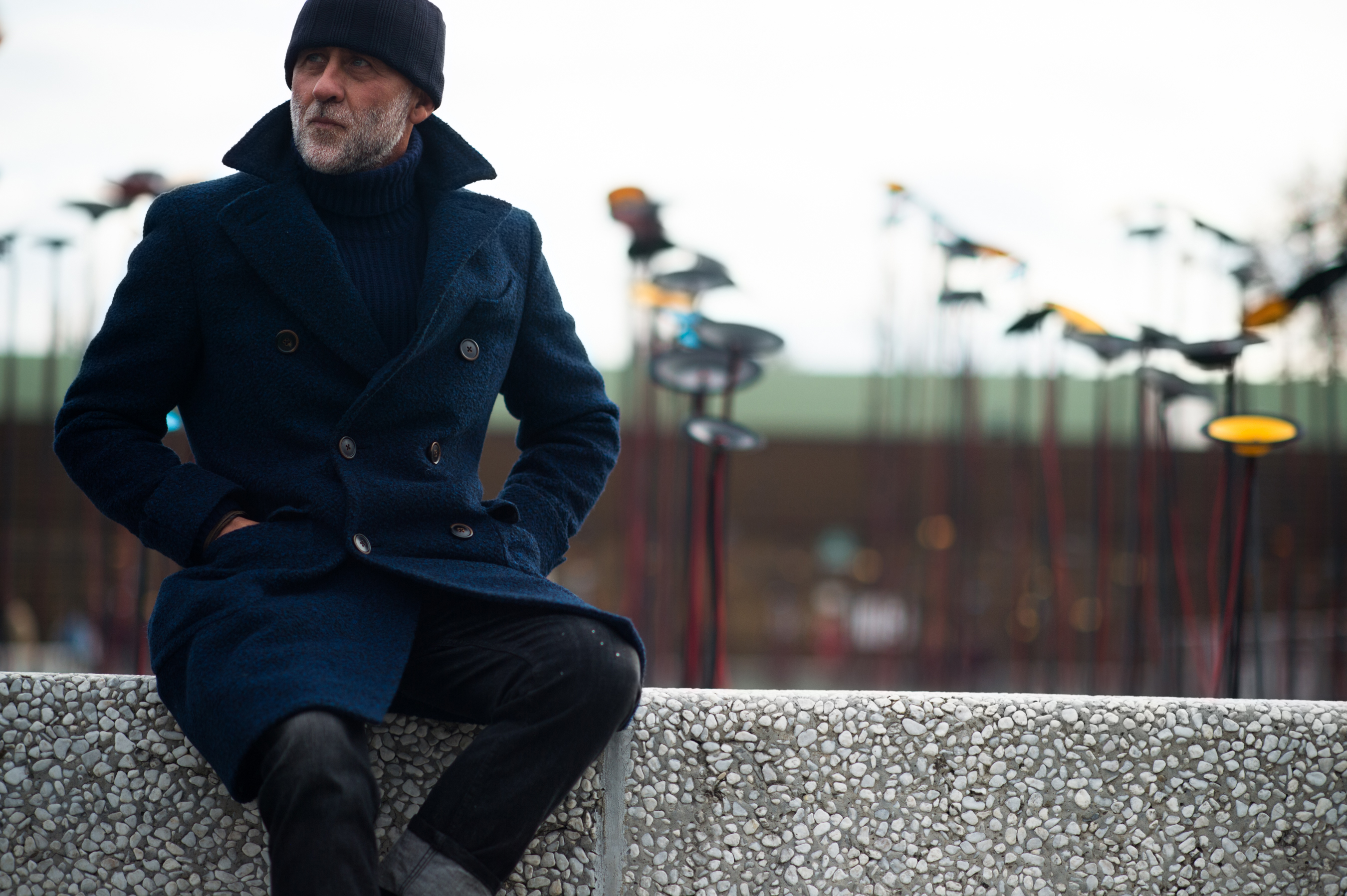 Man wearing a navy blue peacoat