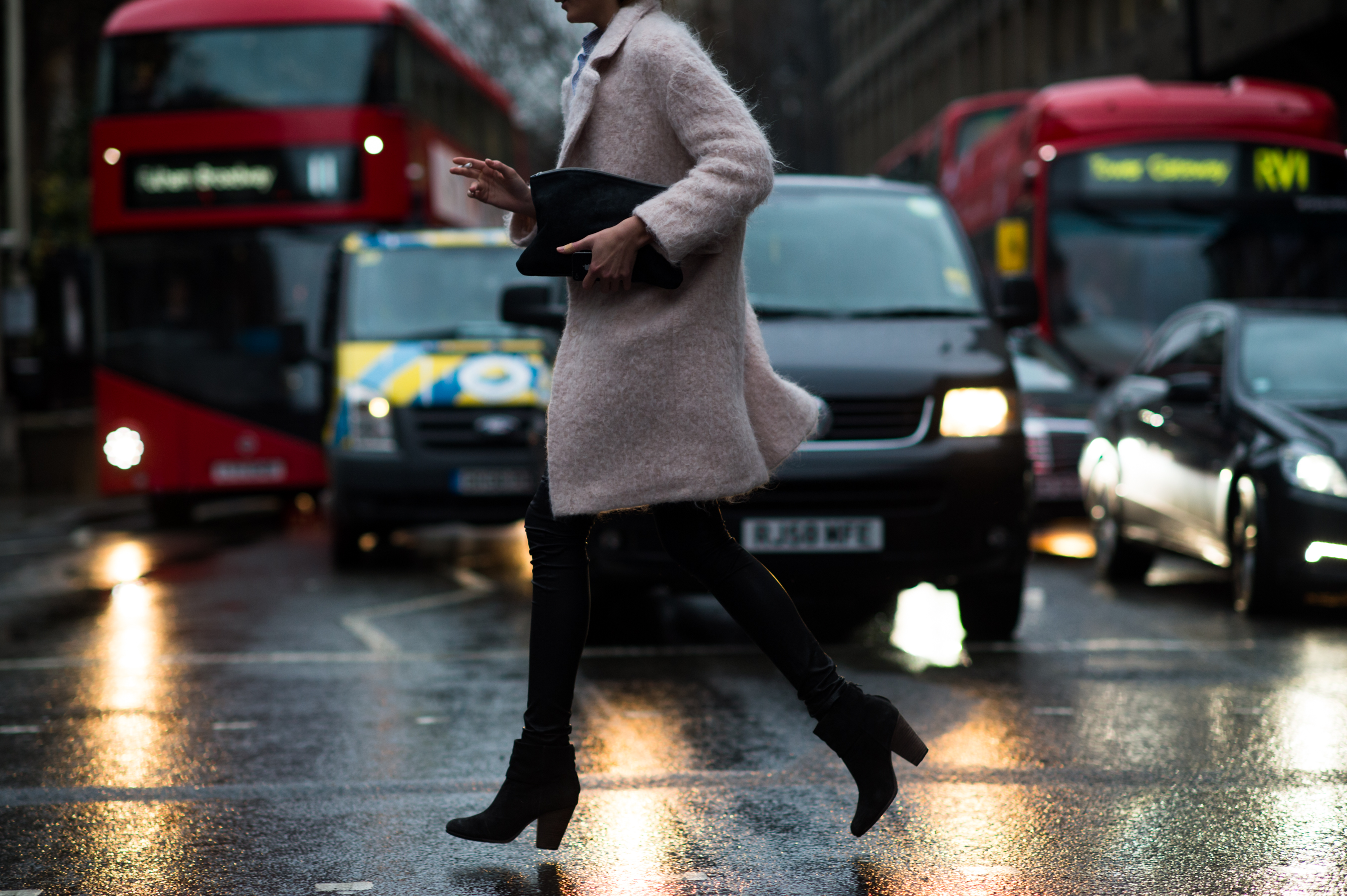 Model running across street in England
