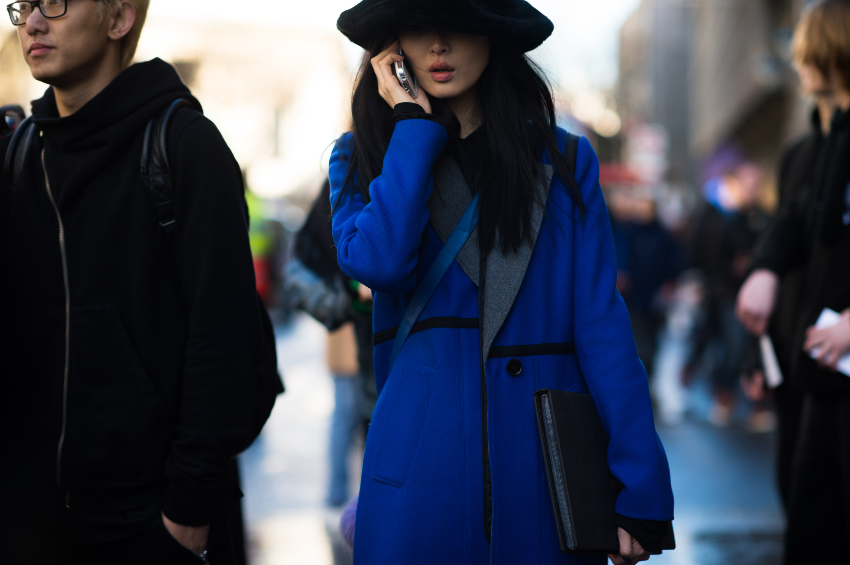 South Korean model wearng fur hat and blue coat