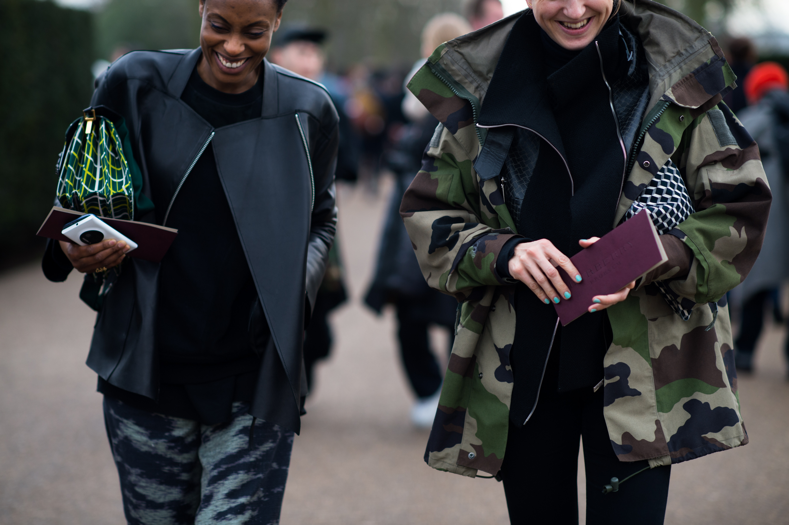 Two women after fashion show in camouflage