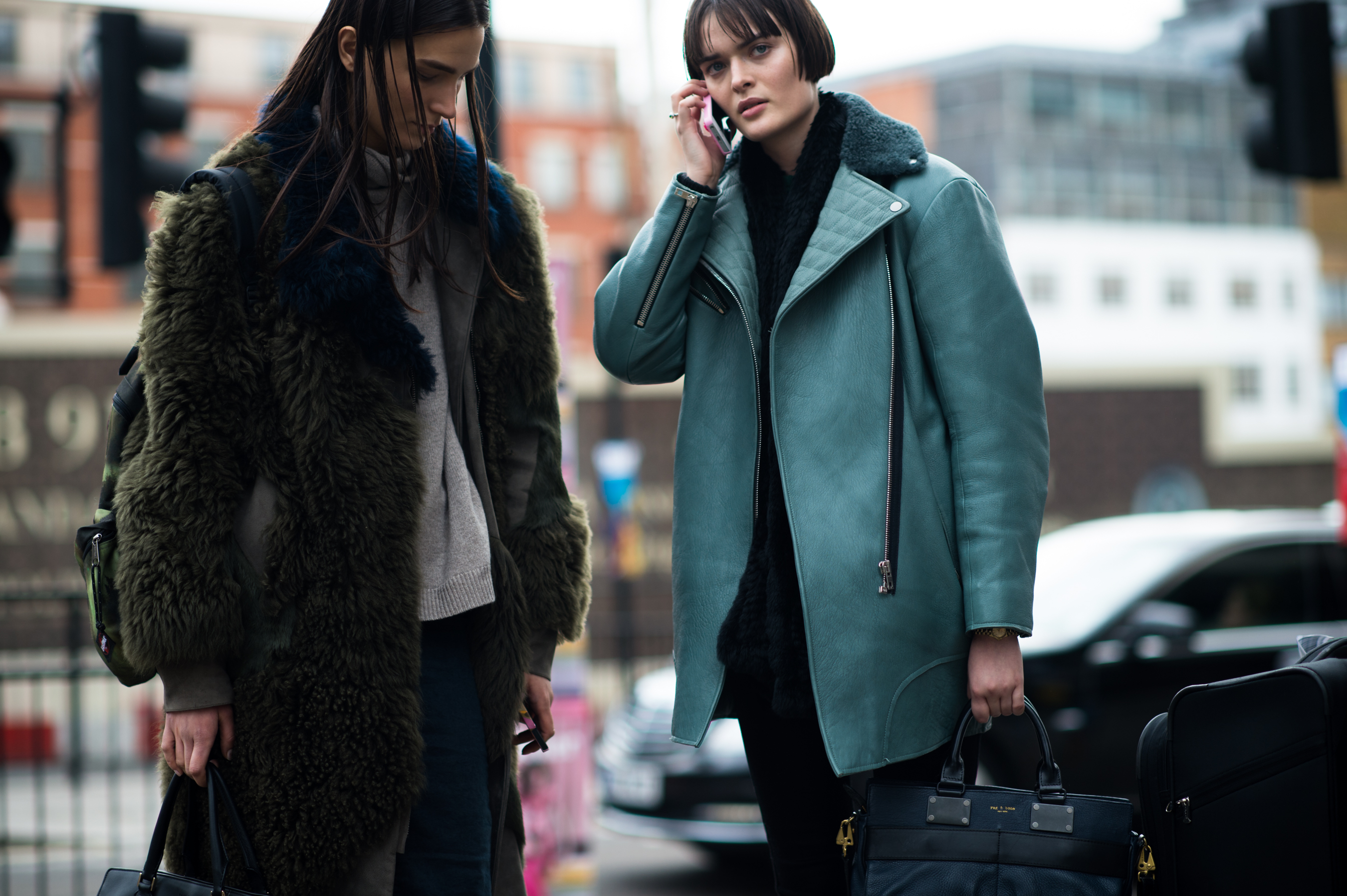 Two models wearing green after show