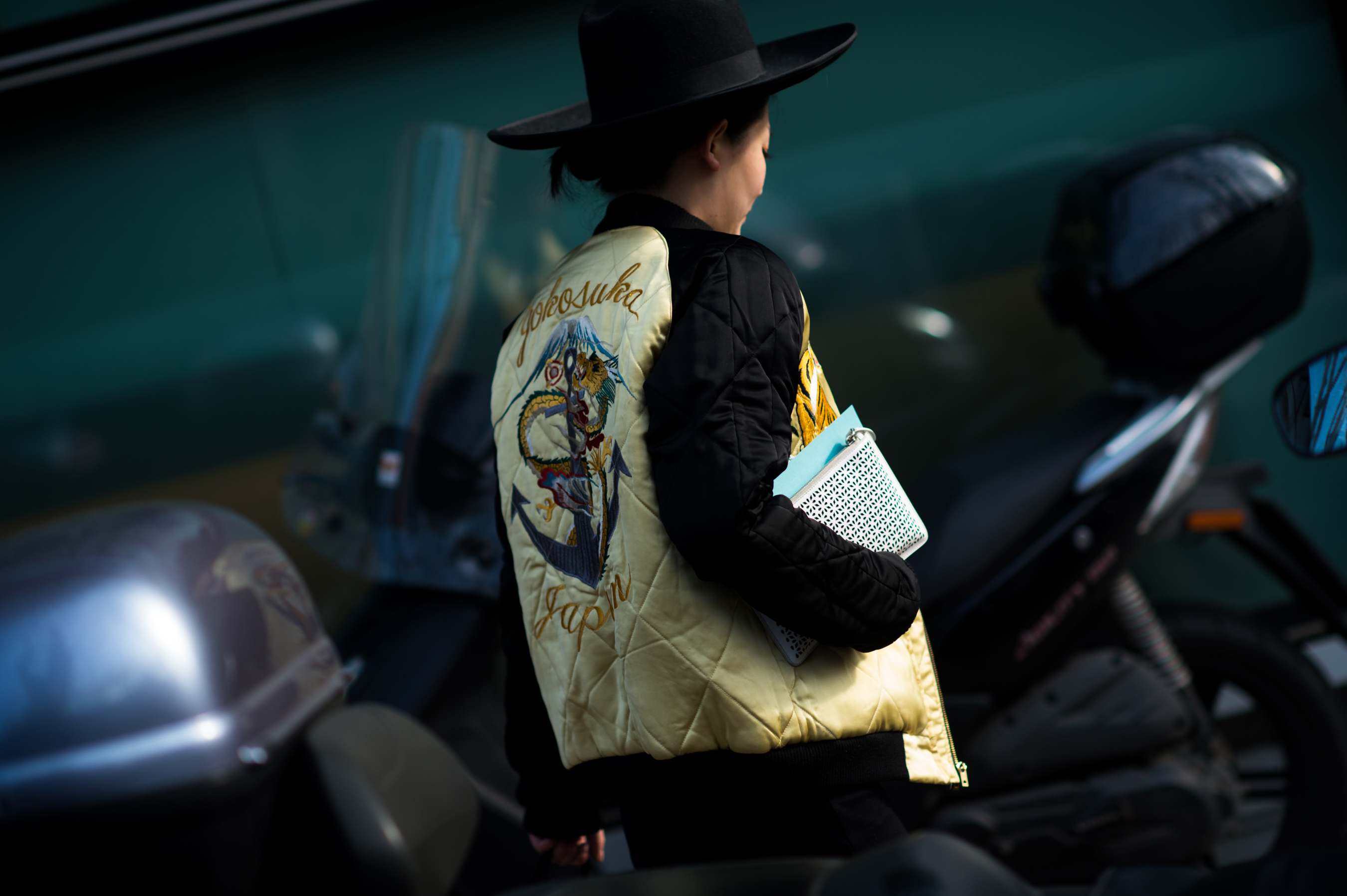 Woman wearing japanese vintage jacket and big hat